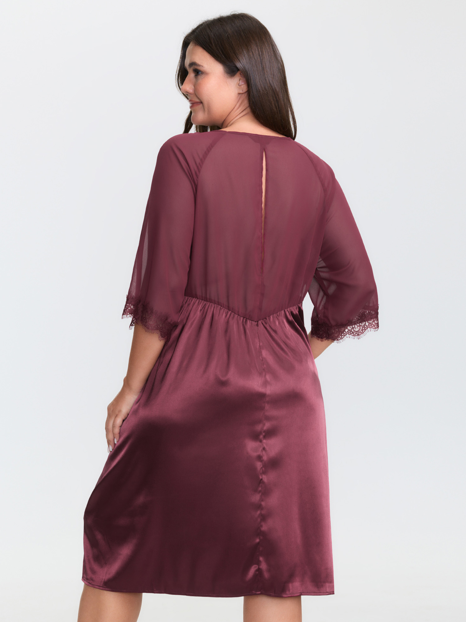 Side view of BloomChic Women's Plus Size Satin Semi-Sheer Sleeve Pleated Nightgown Burgundy Half Sleeve Knee 22-24/3X