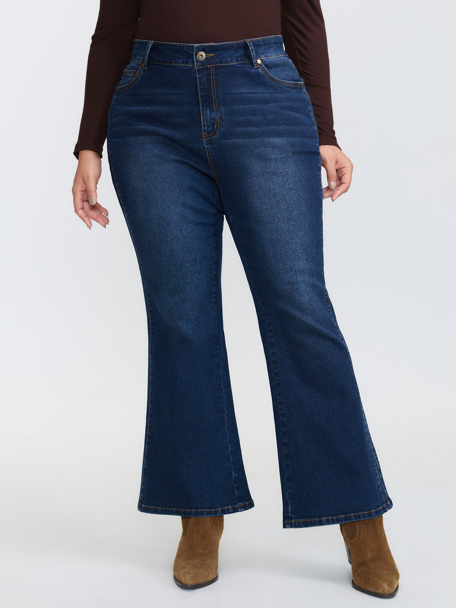 Side view of BloomChic Women's Plus Size Mid-Rise Flare Hem Jeans Denimindigo Flared High stretch 30/6X