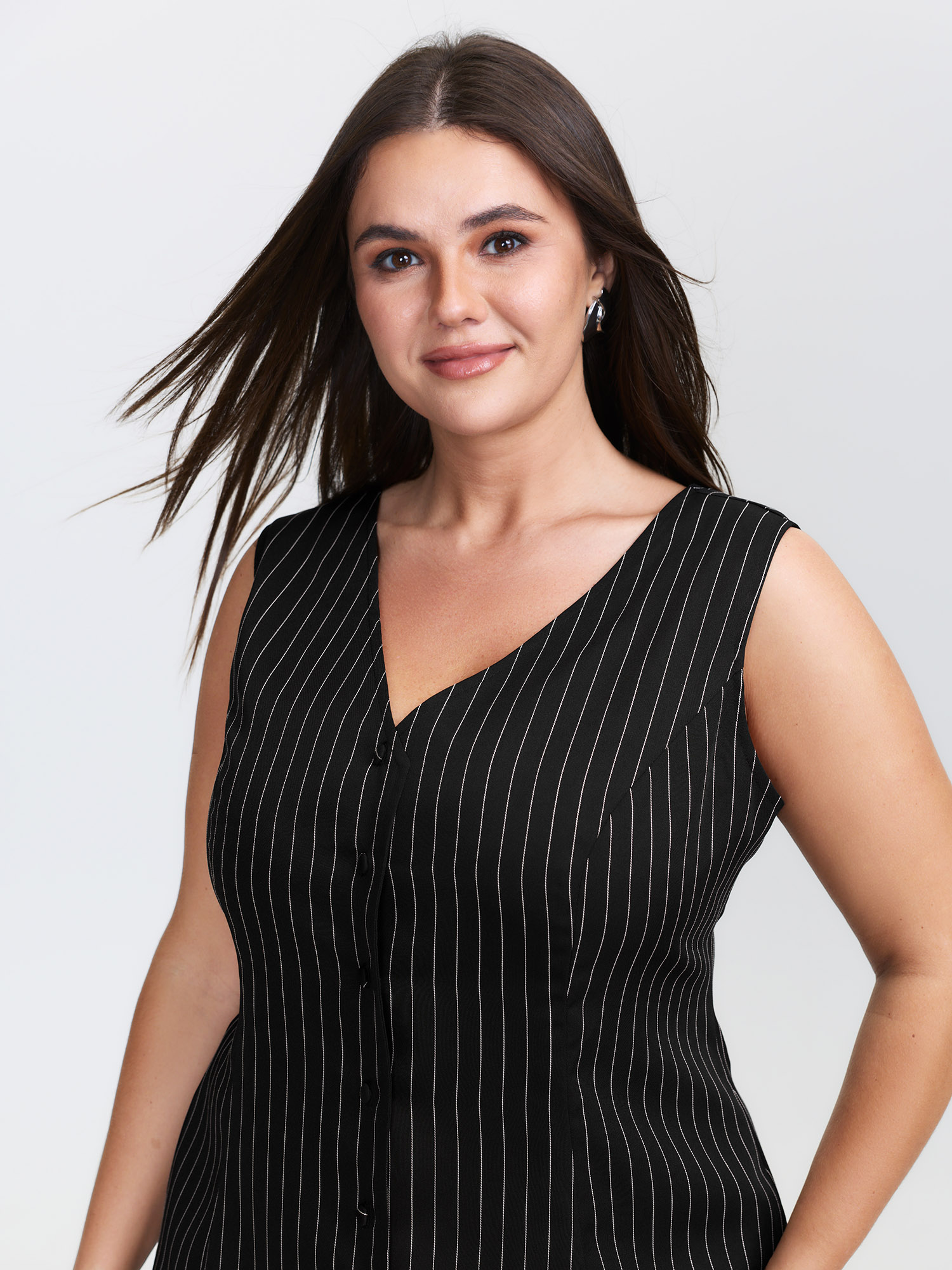 Side view of BloomChic Women's Plus Size Stripe Button Fitted Vest Black 12/L