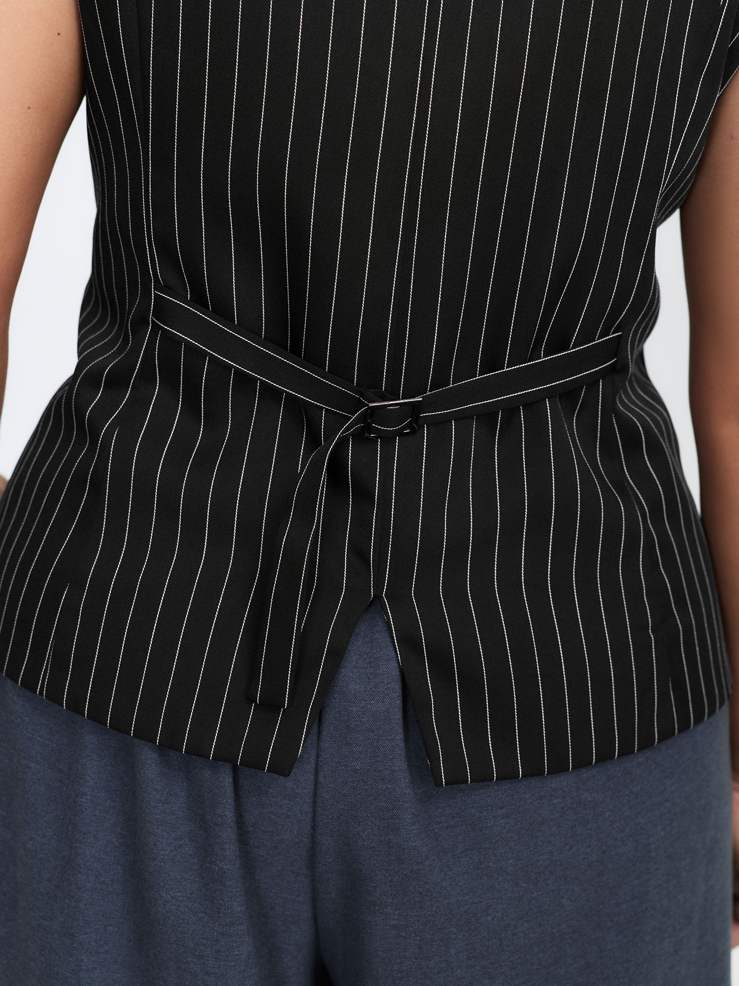 Side view of BloomChic Women's Plus Size Stripe Button Fitted Vest Black 12/L