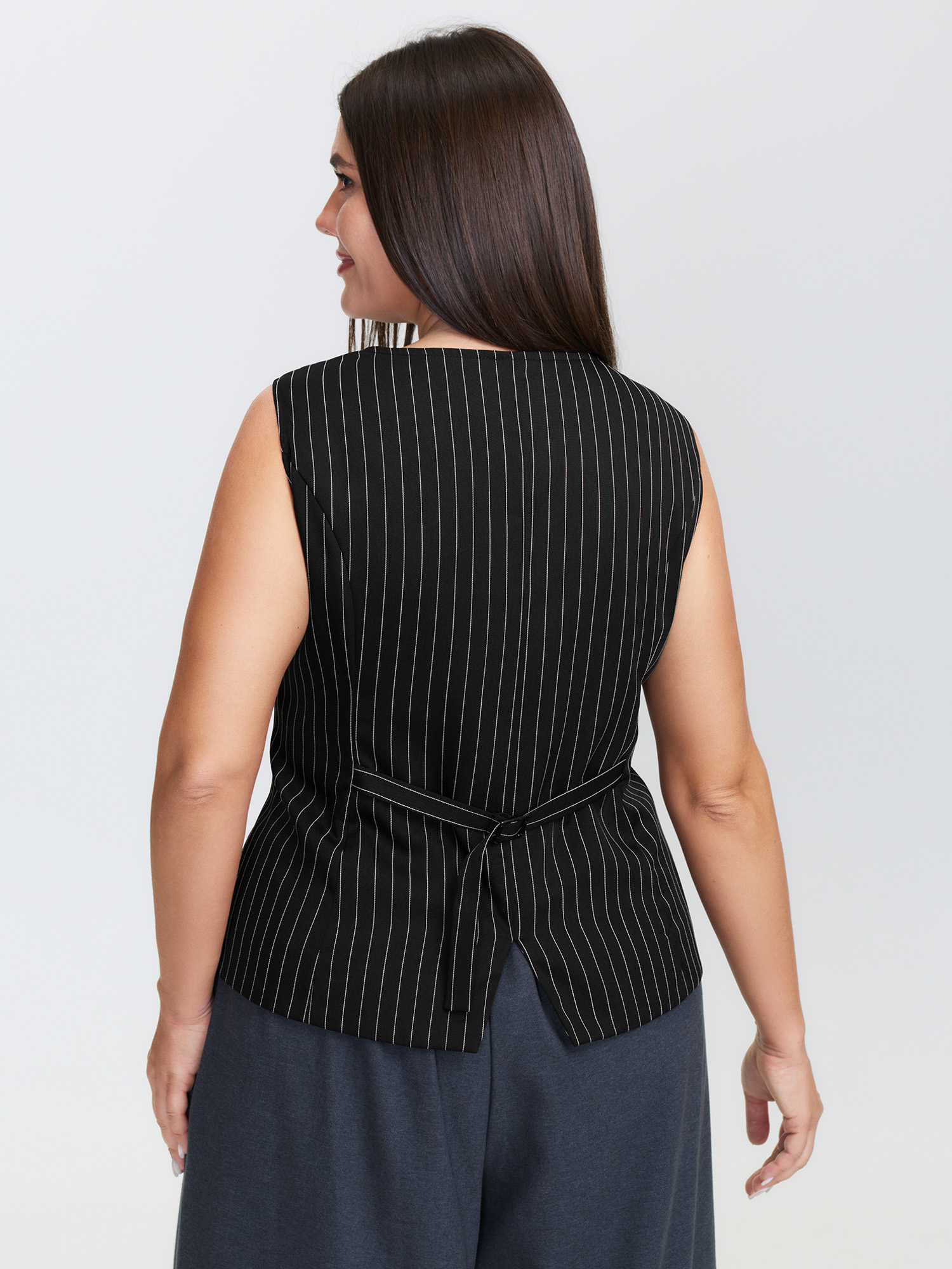 Side view of BloomChic Women's Plus Size Stripe Button Fitted Vest Black 12/L