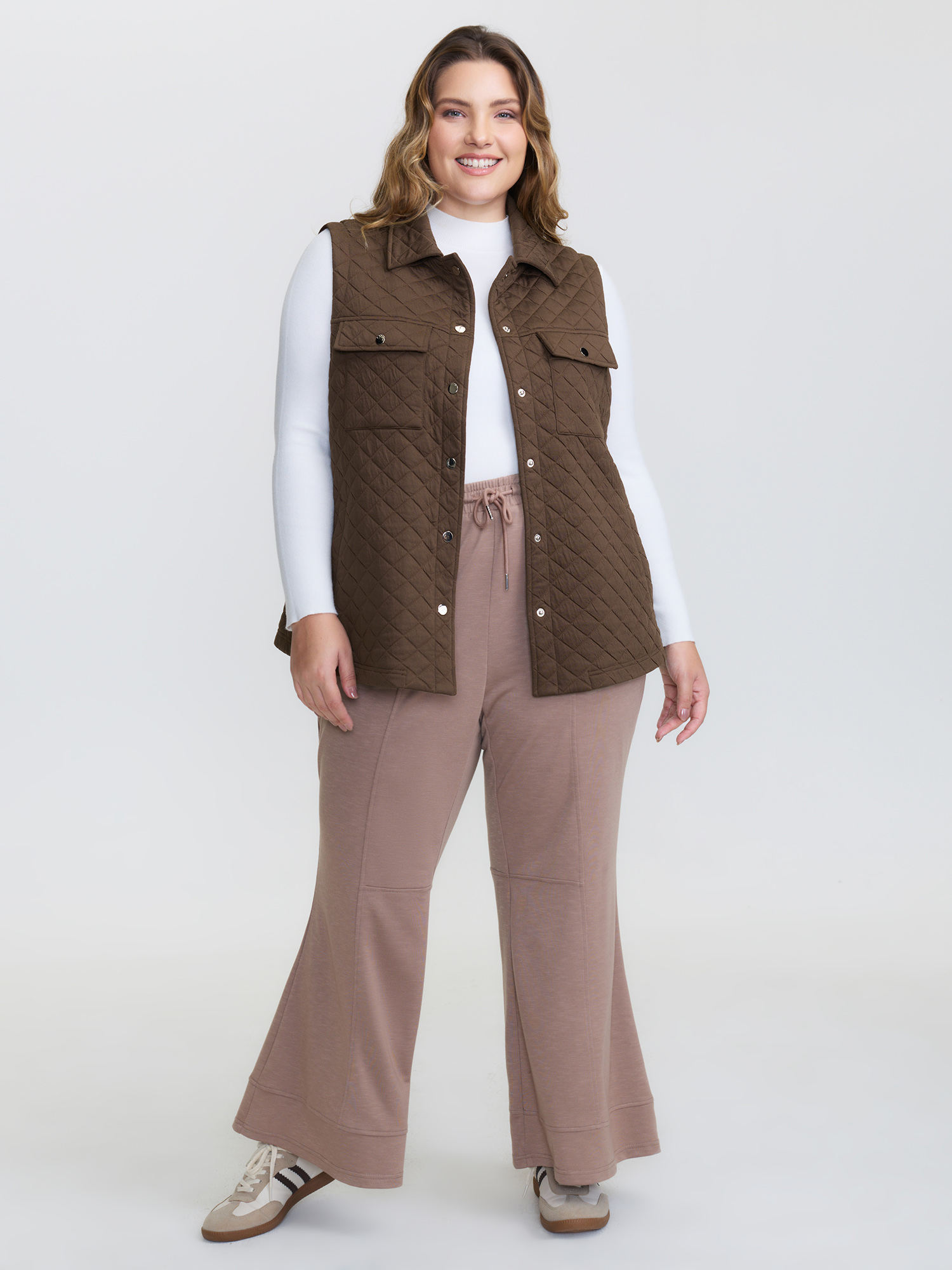 Side view of BloomChic Women's Plus Size Quilted Chest Pockets Button Vest Browncoffeecolor Topstitching 26/4X