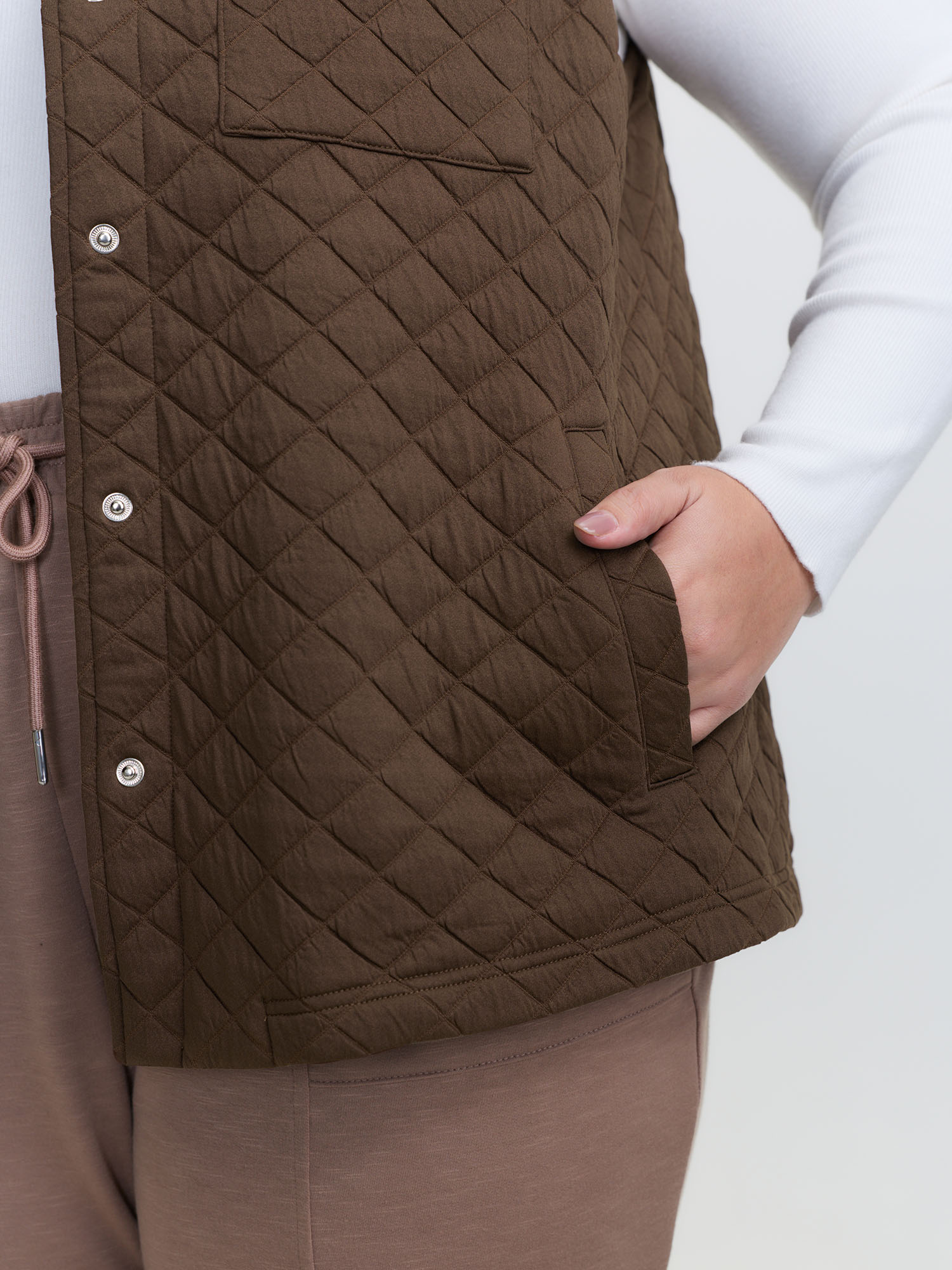 Side view of BloomChic Women's Plus Size Quilted Chest Pockets Button Vest Browncoffeecolor Topstitching 26/4X