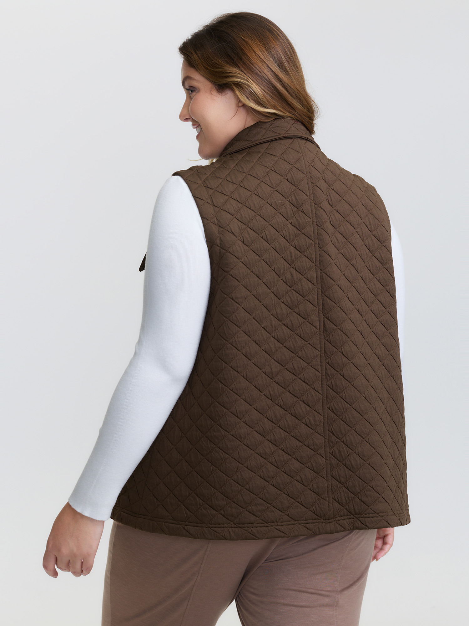 Side view of BloomChic Women's Plus Size Quilted Chest Pockets Button Vest Browncoffeecolor Topstitching 26/4X
