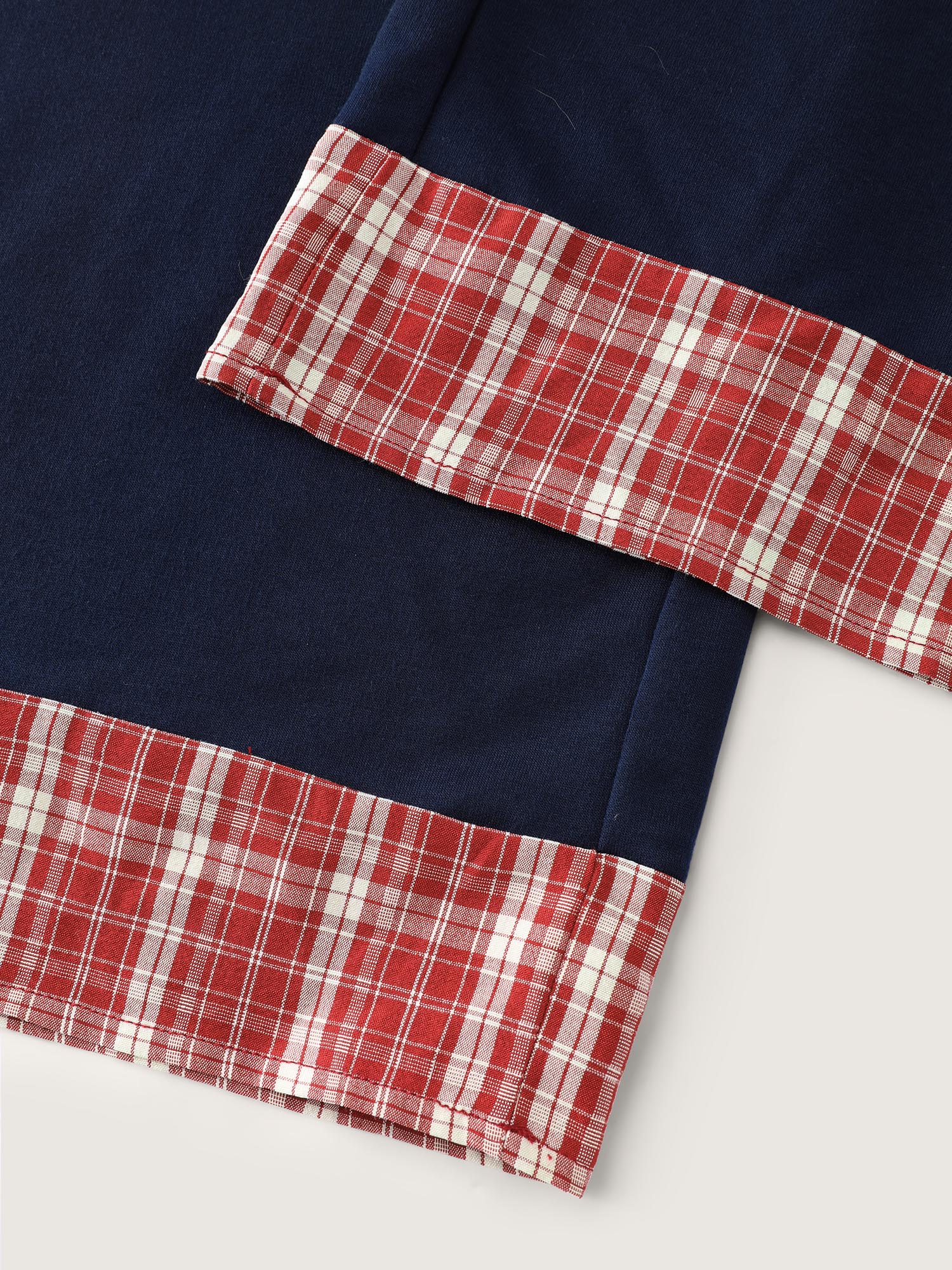 Side view of BloomChic Women's Plus Size Gingham Edges Stretchy Drawstring Lounge Bottoms Indigo Tall 30/6X