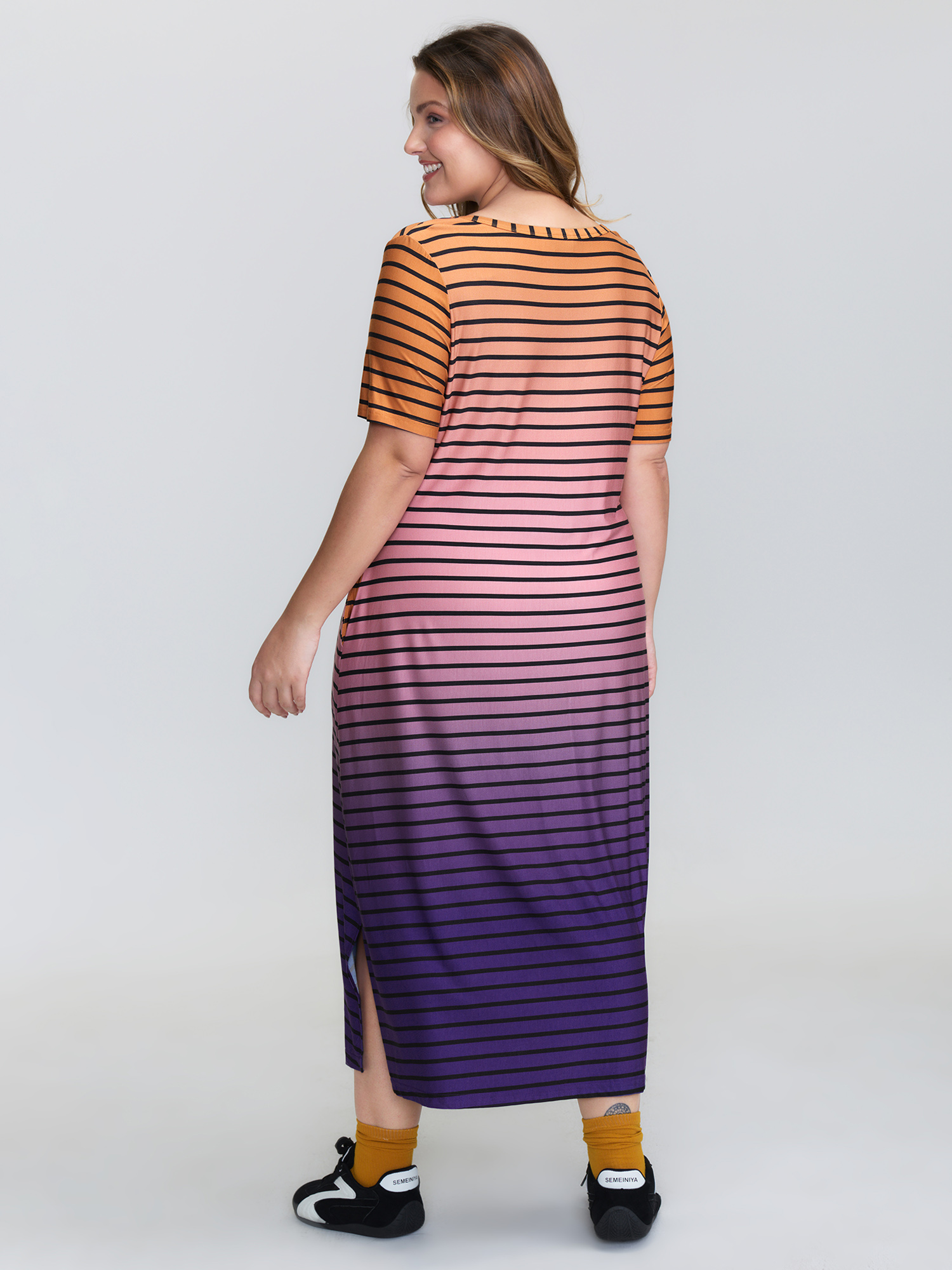 Side view of BloomChic Women's Plus Size Color Gradient Stripe Slit Lounge Dress Multicolor Midi 30/6X