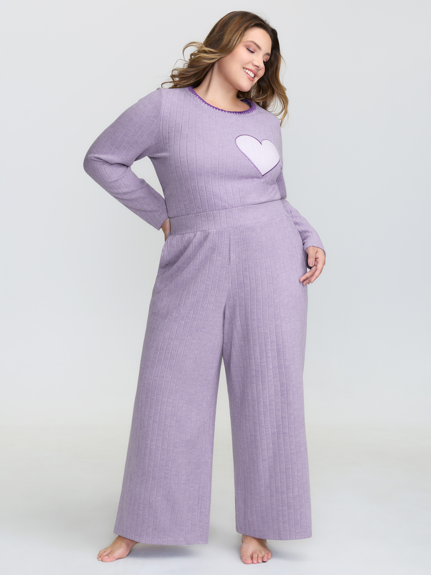 Side view of BloomChic Women's Plus Size Brushed Ribbed Wide-Leg Lounge Bottoms Lilac Short 26/4X