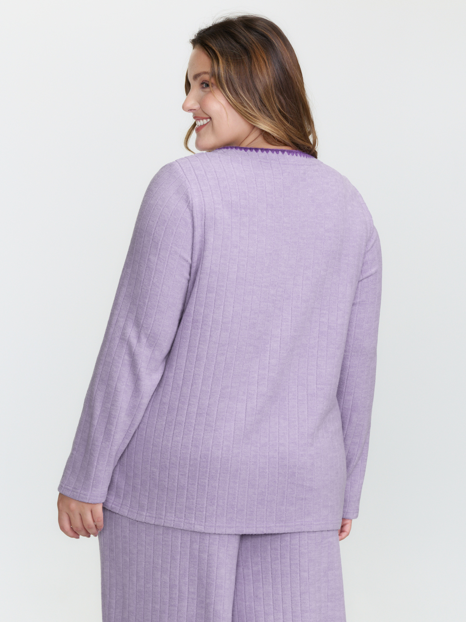 Side view of BloomChic Women's Plus Size Pastel Hearts Brushed Ribbed Embroidered Lounge Top Lilac Extra Long Sleeve 10/M