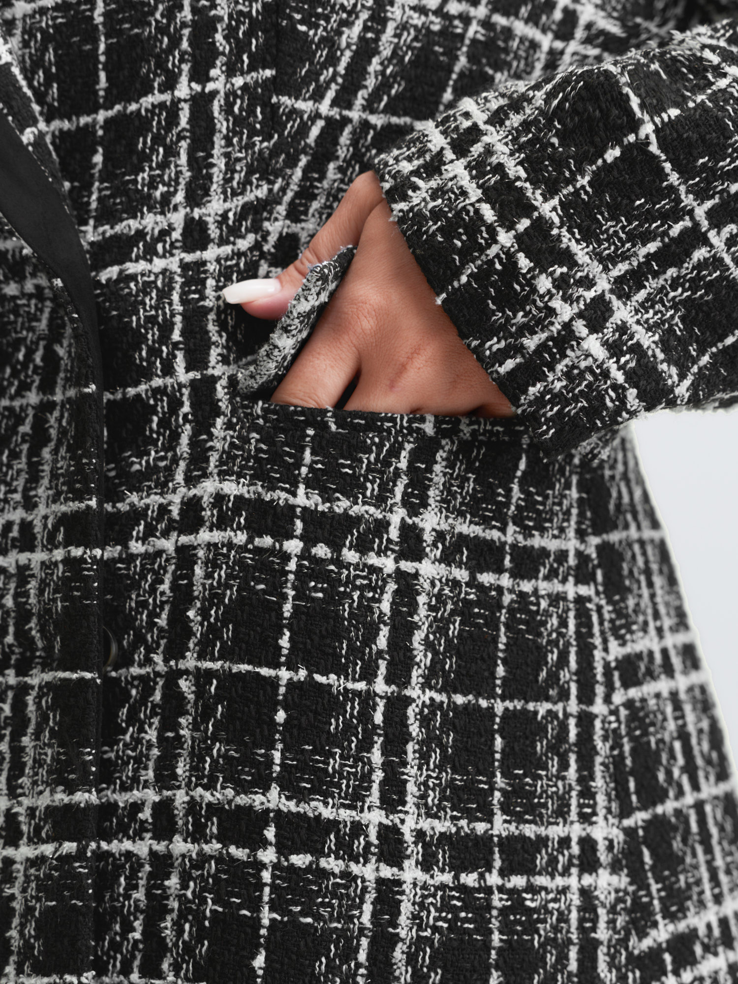 Side view of BloomChic Women's Plus Size Tweed Print Lined Double Breasted Blazer Black Sleeve Extra Long Sleeve 18-20/2X