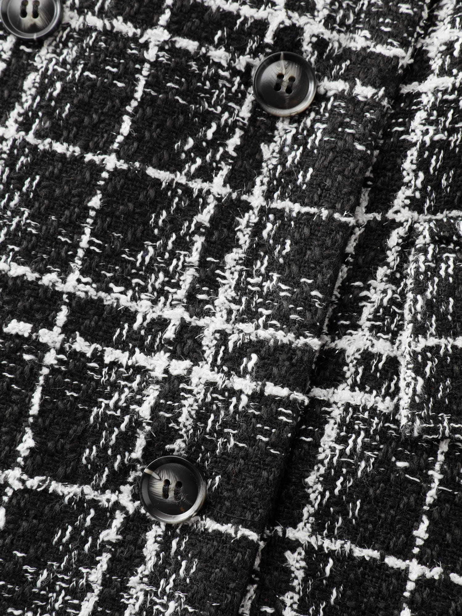Side view of BloomChic Women's Plus Size Tweed Print Lined Double Breasted Blazer Black Sleeve Extra Long Sleeve 18-20/2X