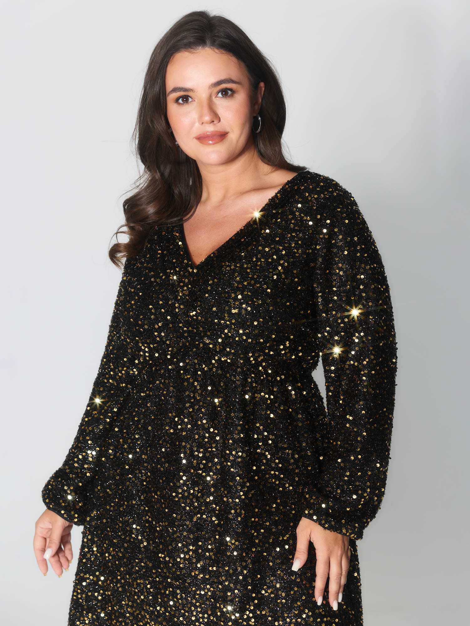 Side view of BloomChic Women's Plus Size Shimmery Sequin V-Neck Knee Dress Black Party Smocked V-Neck 14-16/1X