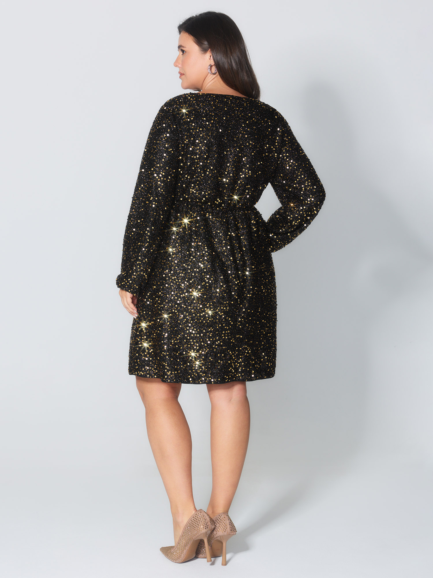 Side view of BloomChic Women's Plus Size Shimmery Sequin V-Neck Knee Dress Black Party Smocked V-Neck 14-16/1X