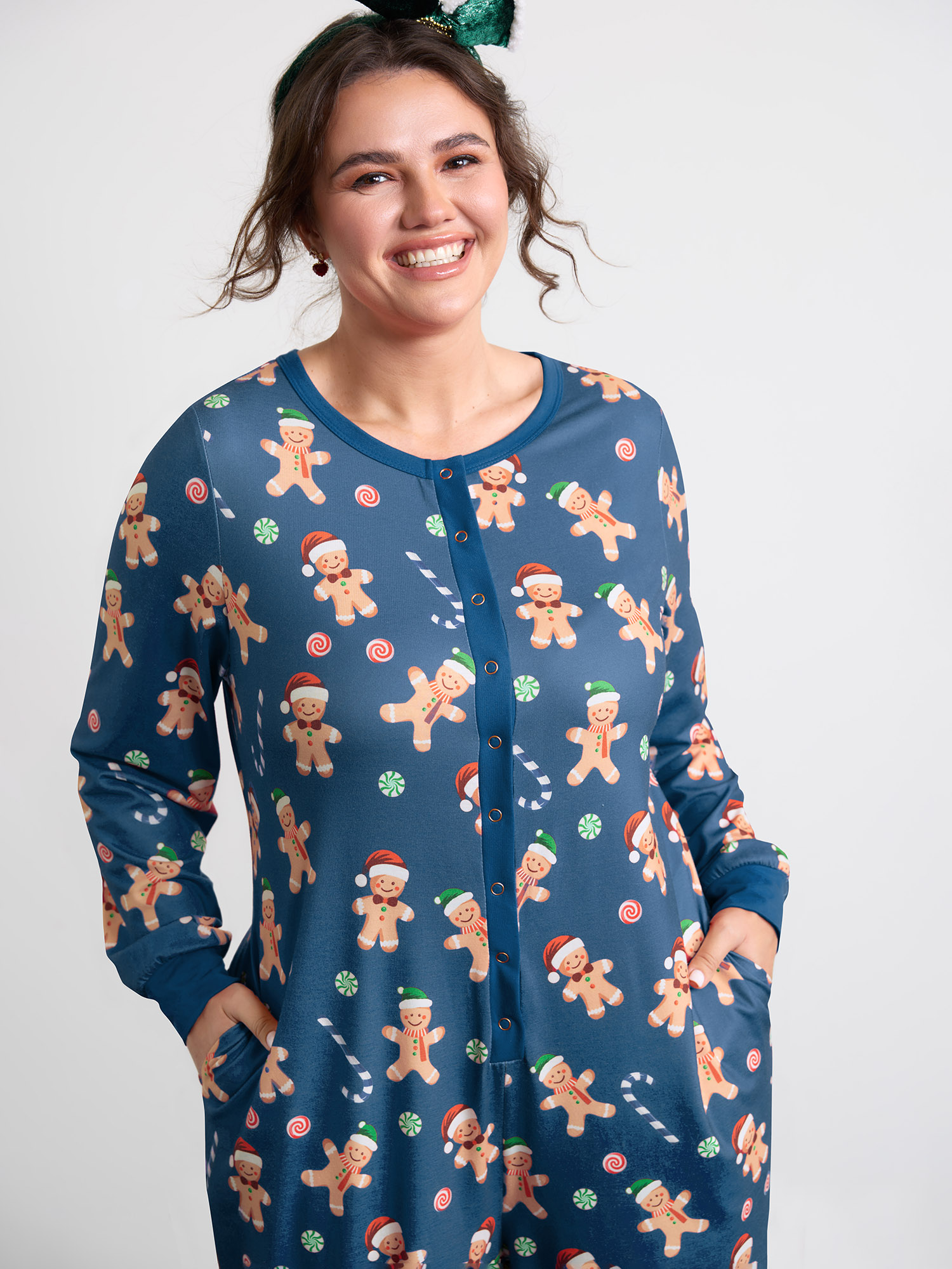 Side view of BloomChic Women's Plus Size Gingerbread Print Button Placket Jumpsuit Navy not graphics 10/M