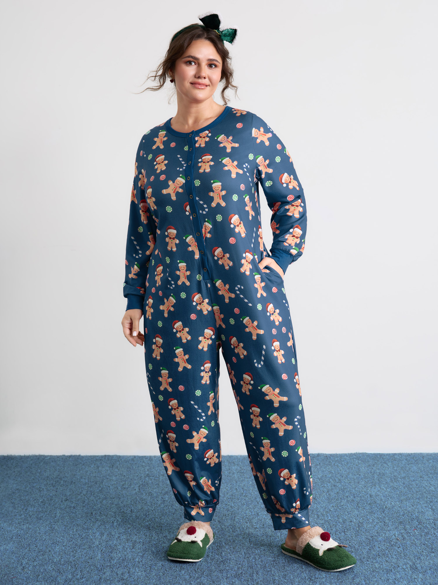 Side view of BloomChic Women's Plus Size Gingerbread Print Button Placket Jumpsuit Navy not graphics 10/M
