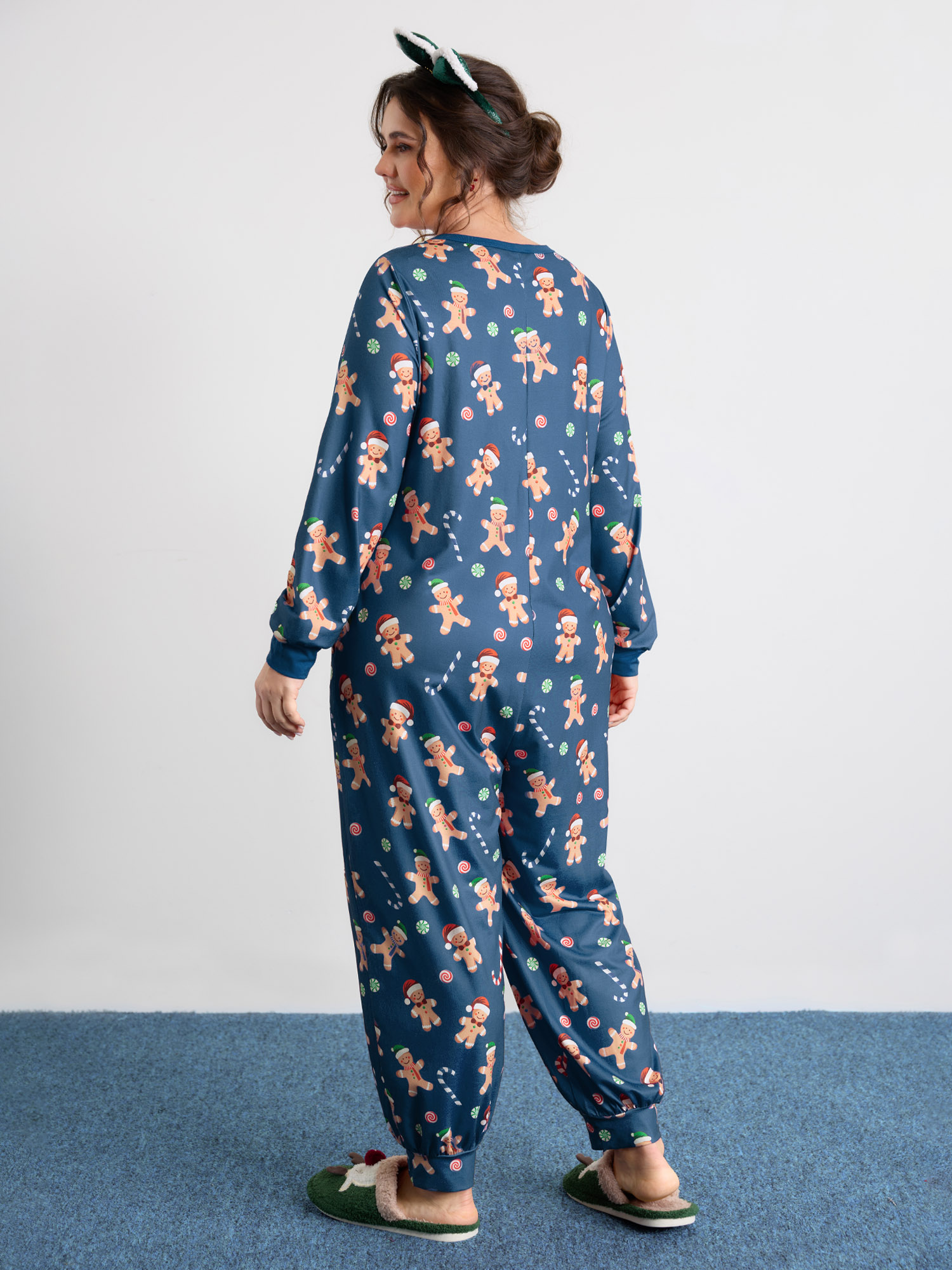Side view of BloomChic Women's Plus Size Gingerbread Print Button Placket Jumpsuit Navy not graphics 10/M