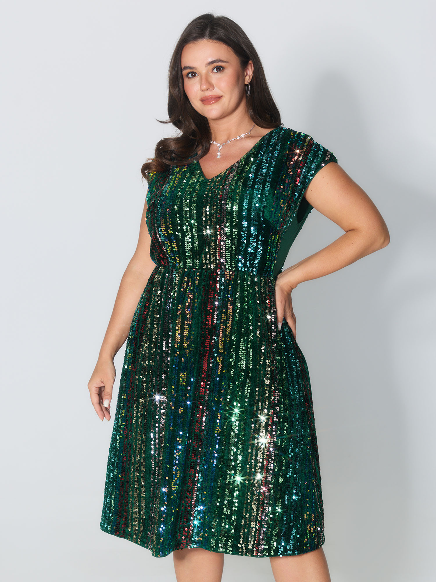 Side view of BloomChic Women's Plus Size Shimmery Sequin Stripe Cinched-Waist Mini Dress DarkGreen Party Mini Sequin 22-24/3X