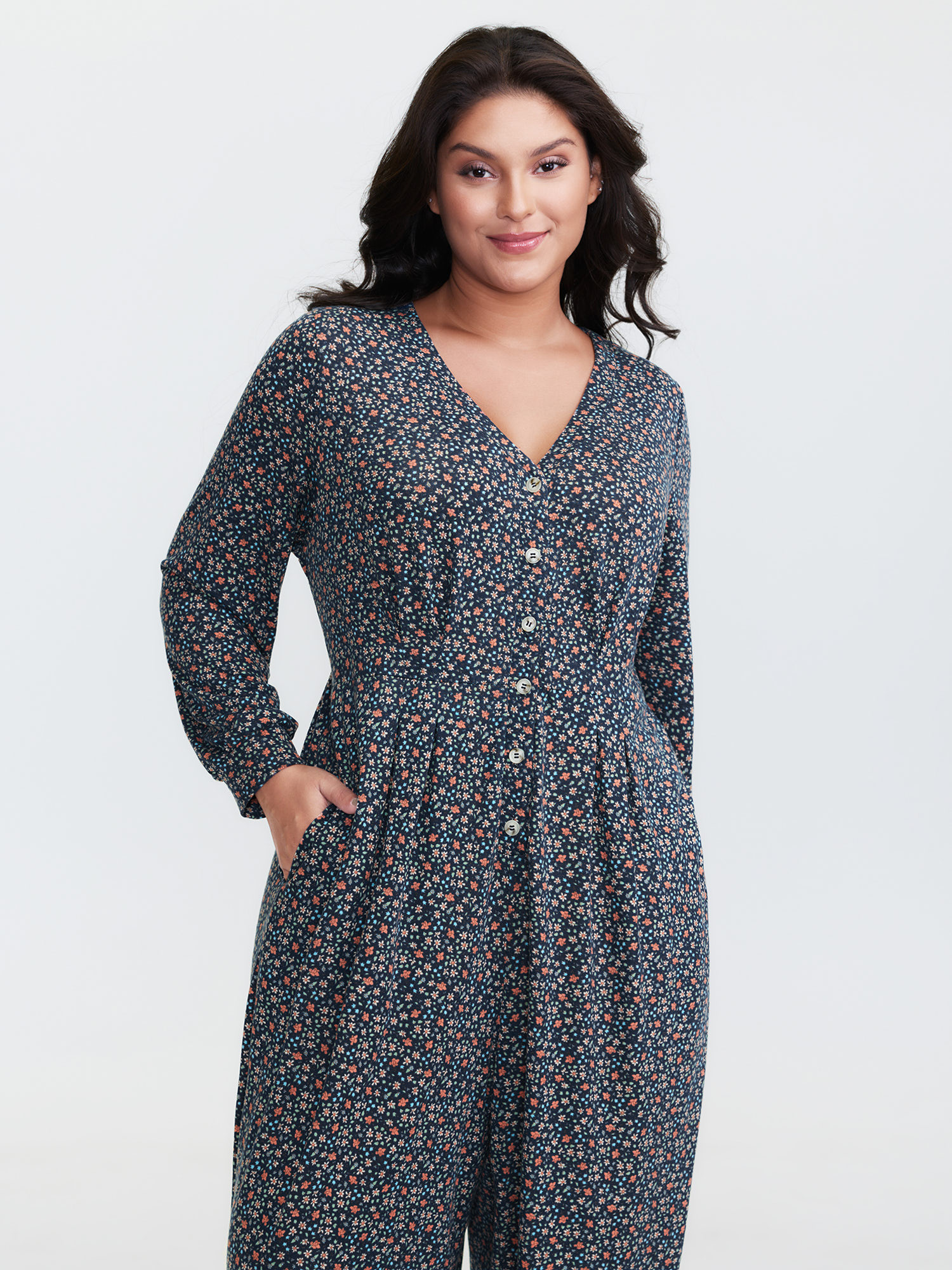 Side view of BloomChic Women's Plus Size Floral Print V-Neck Button Front Lounge Jumpsuit Indigo Natural Flowers Maxi 28/5X