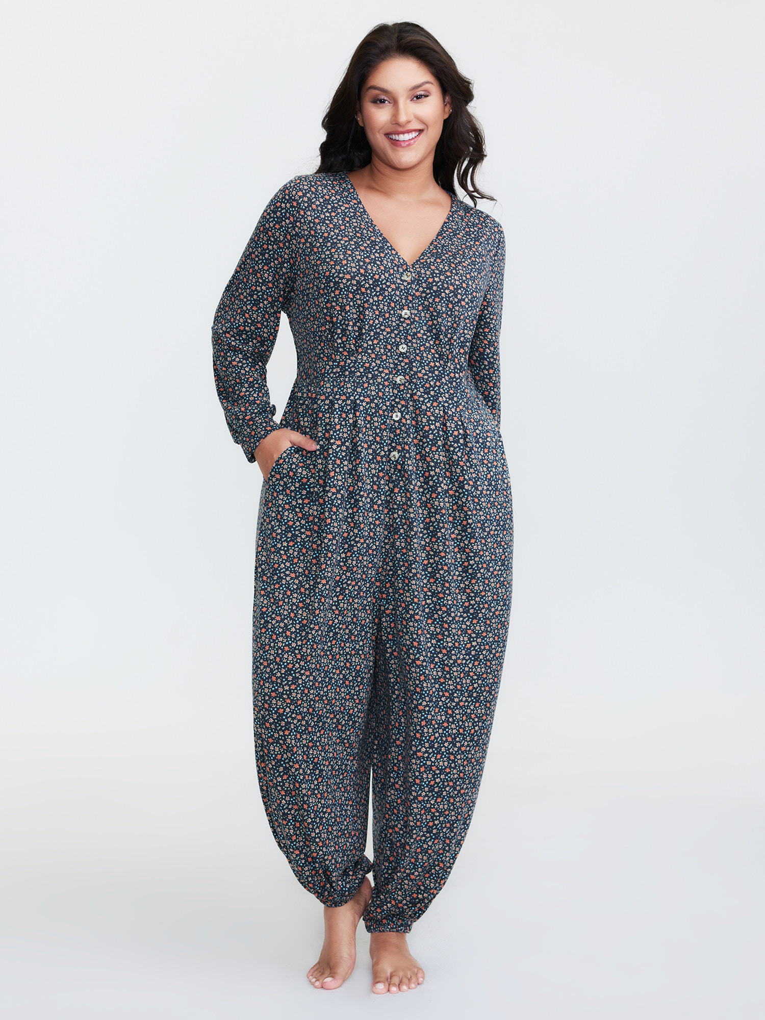 Side view of BloomChic Women's Plus Size Floral Print V-Neck Button Front Lounge Jumpsuit Indigo Natural Flowers Maxi 28/5X