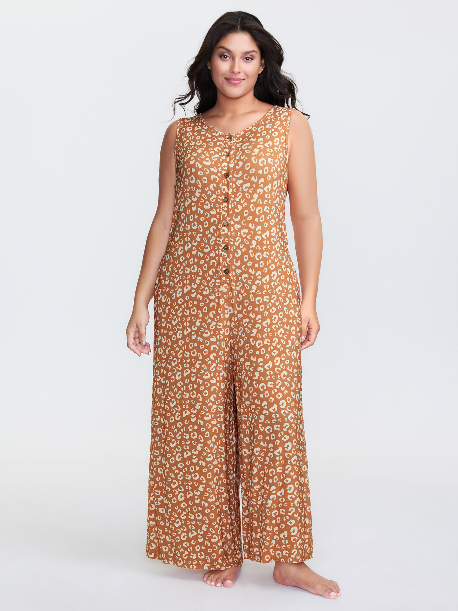 Side view of BloomChic Women's Plus Size Leopard Print Sleeveless Button Front Lounge jumpsuit Yellowishbrown Maxi 26/4X