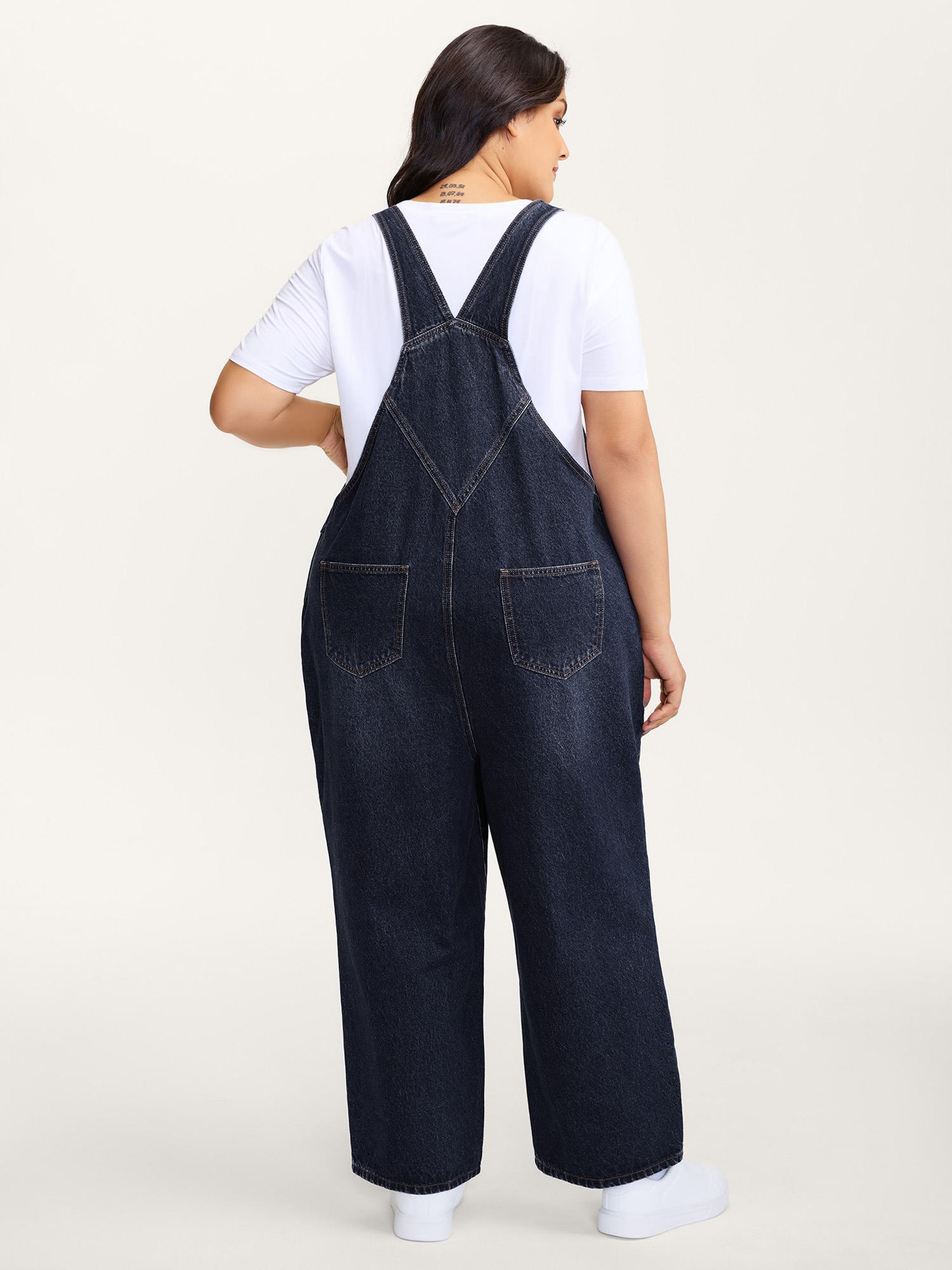 Side view of BloomChic Women's Plus Size Cotton Relaxed-Fit Side Button Overall Denim Jumpsuit Midnight not graphics Casual Non No stretch 20/2X