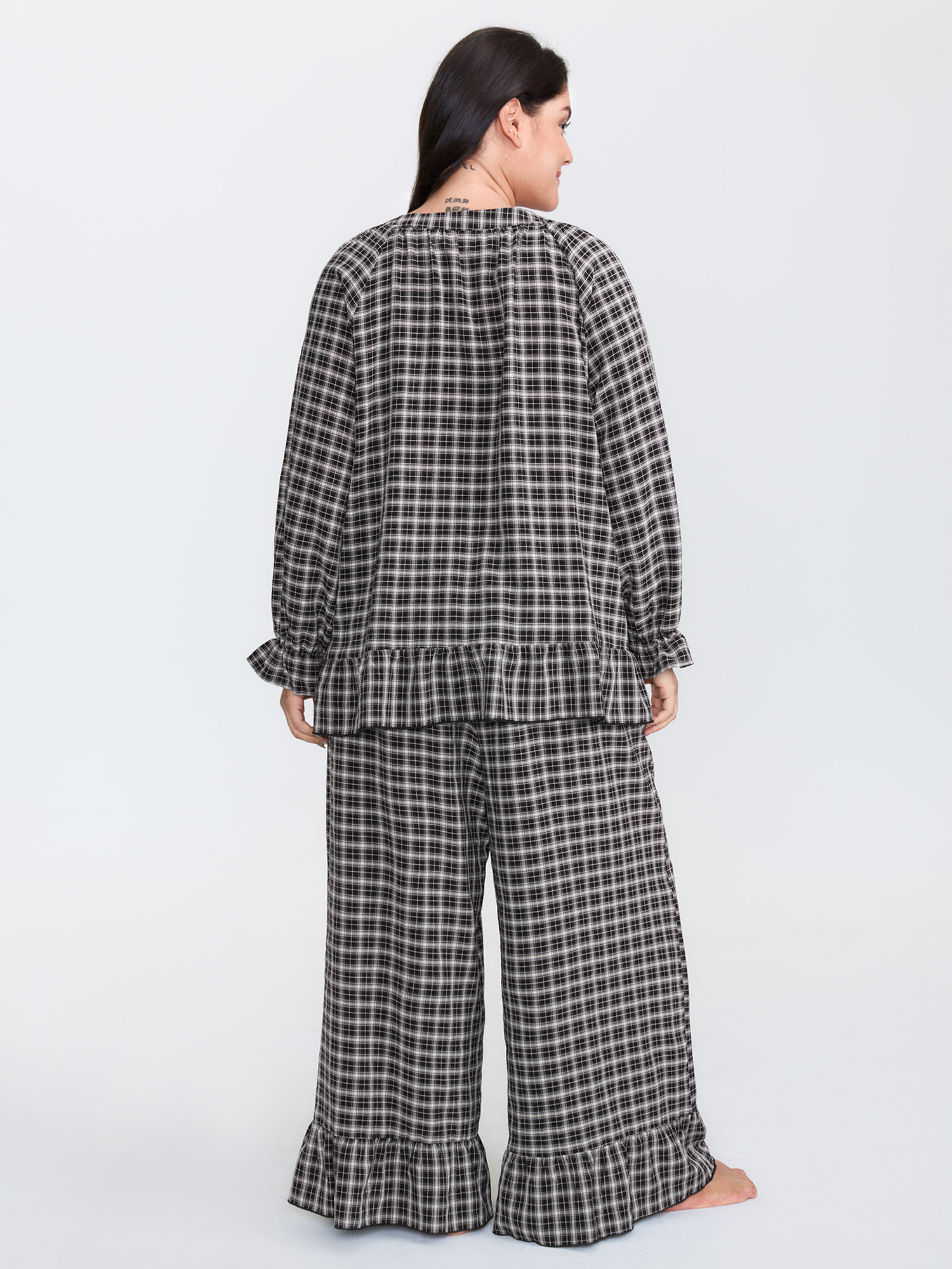 Side view of BloomChic Women's Plus Size Gingham Print Ruffled Hem Co-Ord Pajama Set BlackFlower not graphics 12/L