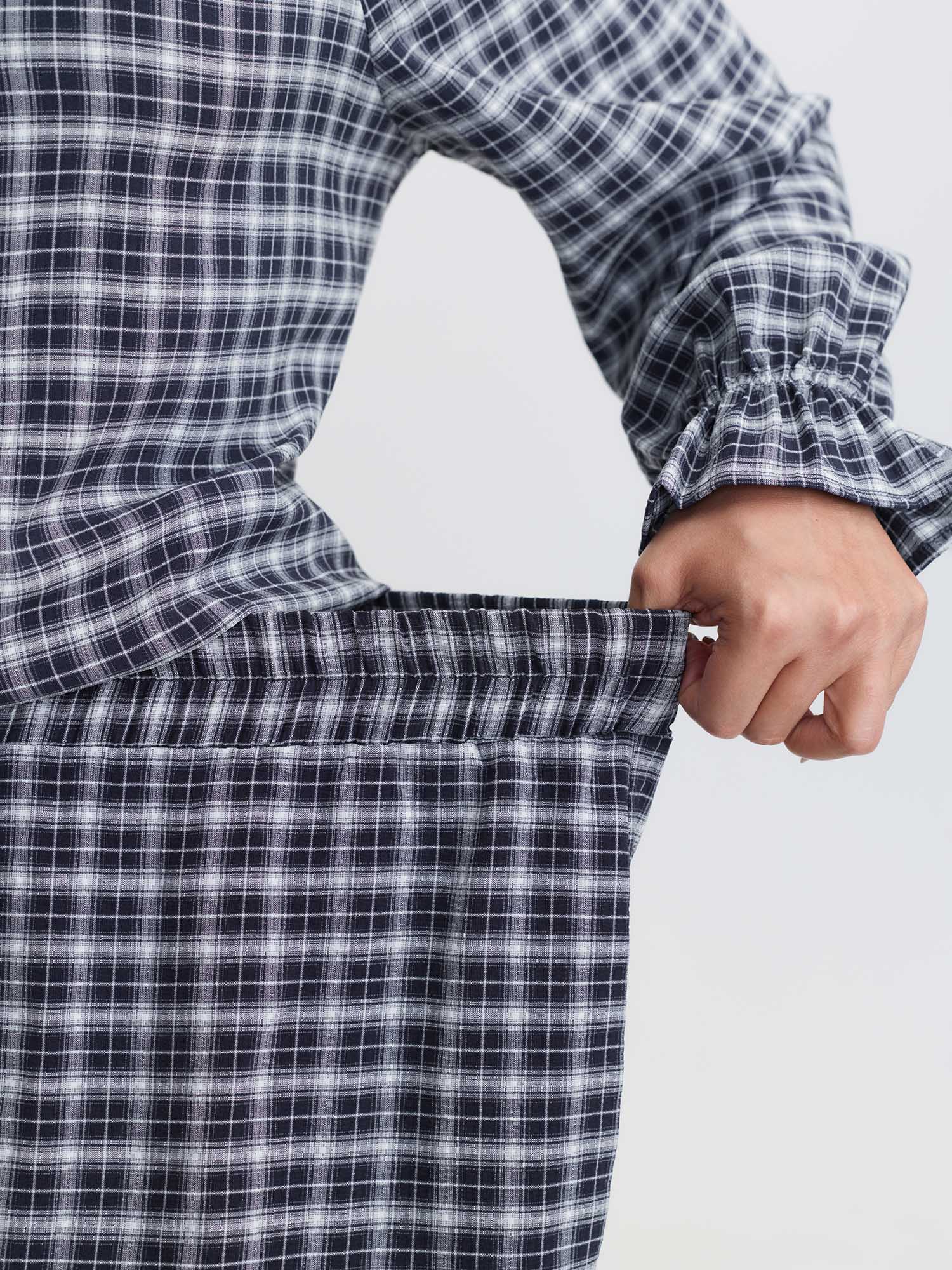 Side view of BloomChic Women's Plus Size Gingham Print Ruffled Hem Co-Ord Pajama Set Indigo not graphics 10/M