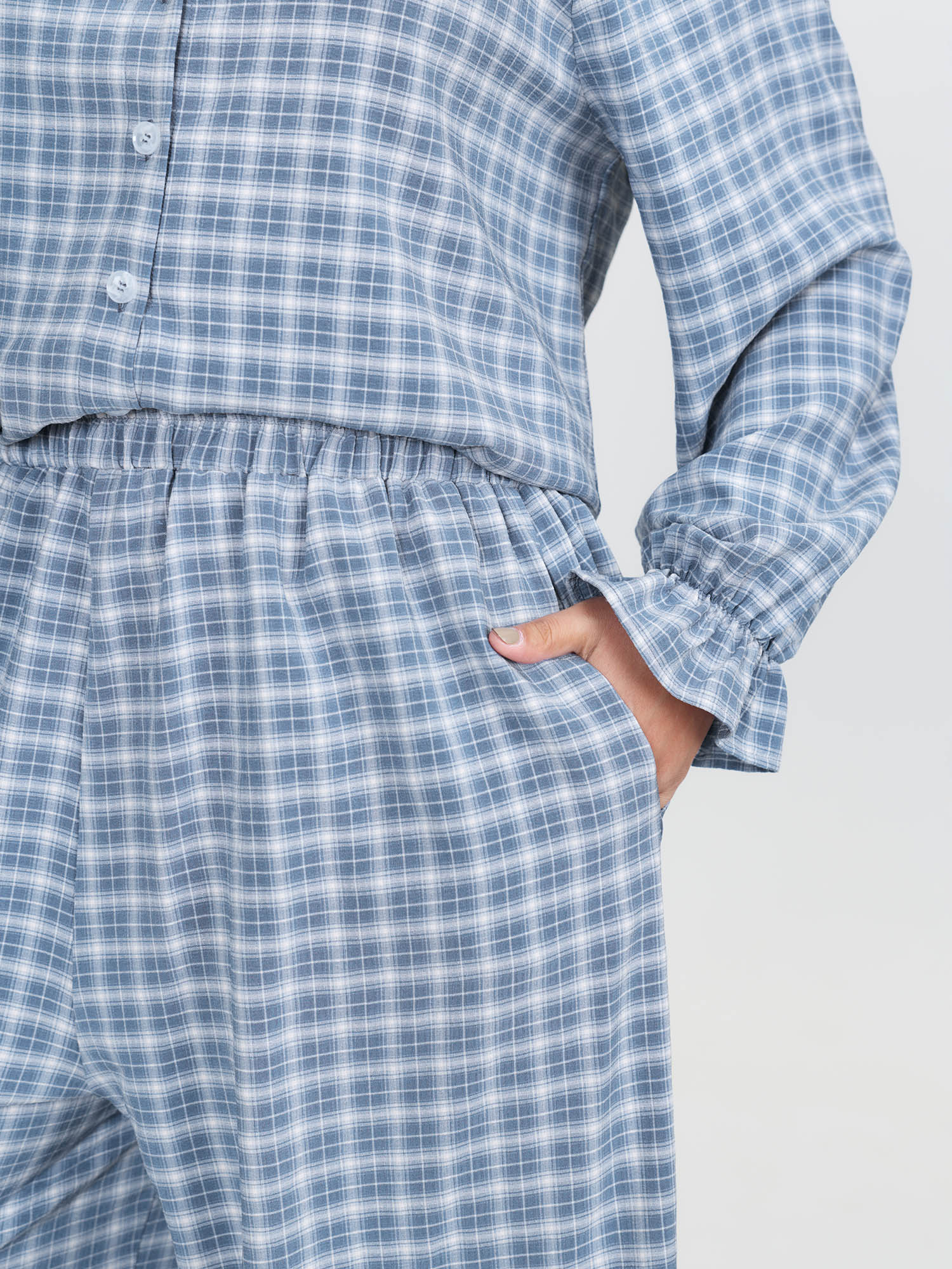 Side view of BloomChic Women's Plus Size Gingham Print Ruffled Hem Co-Ord Pajama Set Mediumblue not graphics 26/4X