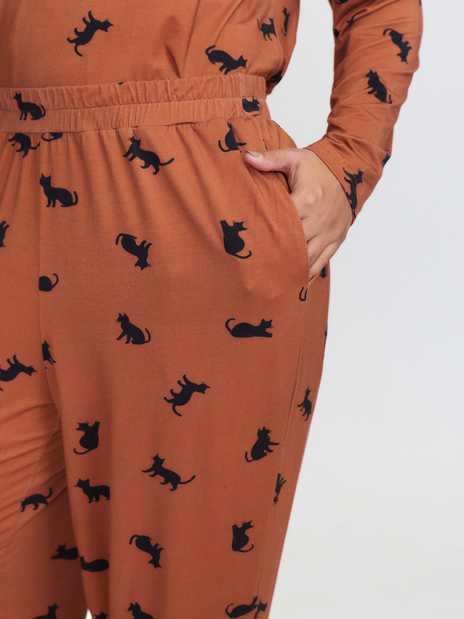 Side view of BloomChic Women's Plus Size Midnight Cat Print Stretchy Lounge Bottoms Yellowishbrown 10/M