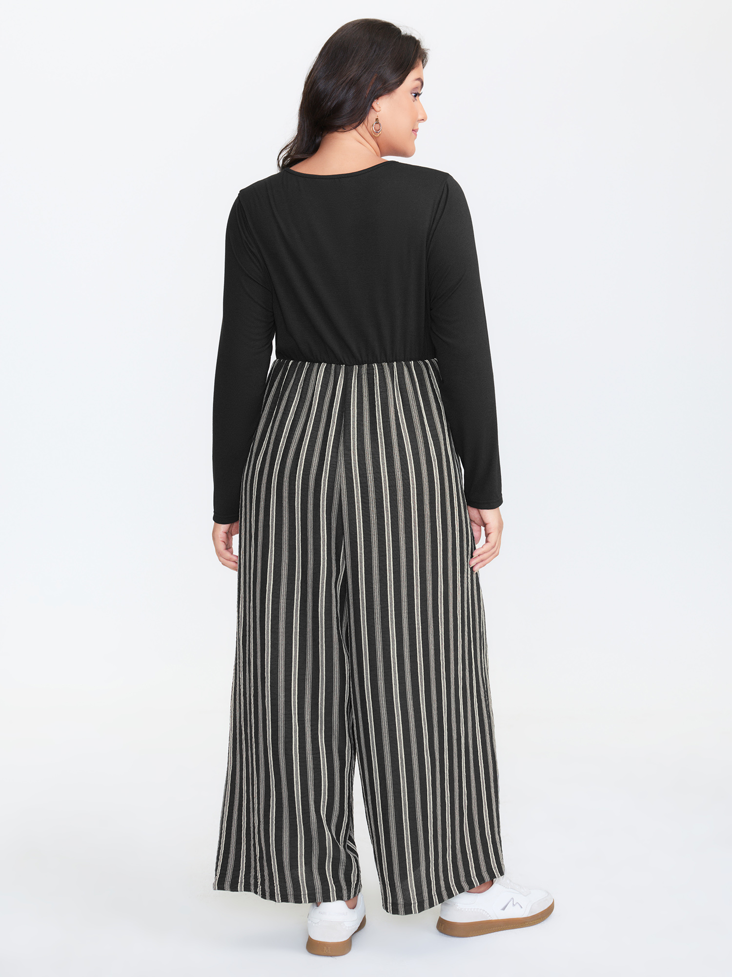 Side view of BloomChic Women's Plus Size Stripes Color Contrast Jumpsuit Black Casual 30/6X