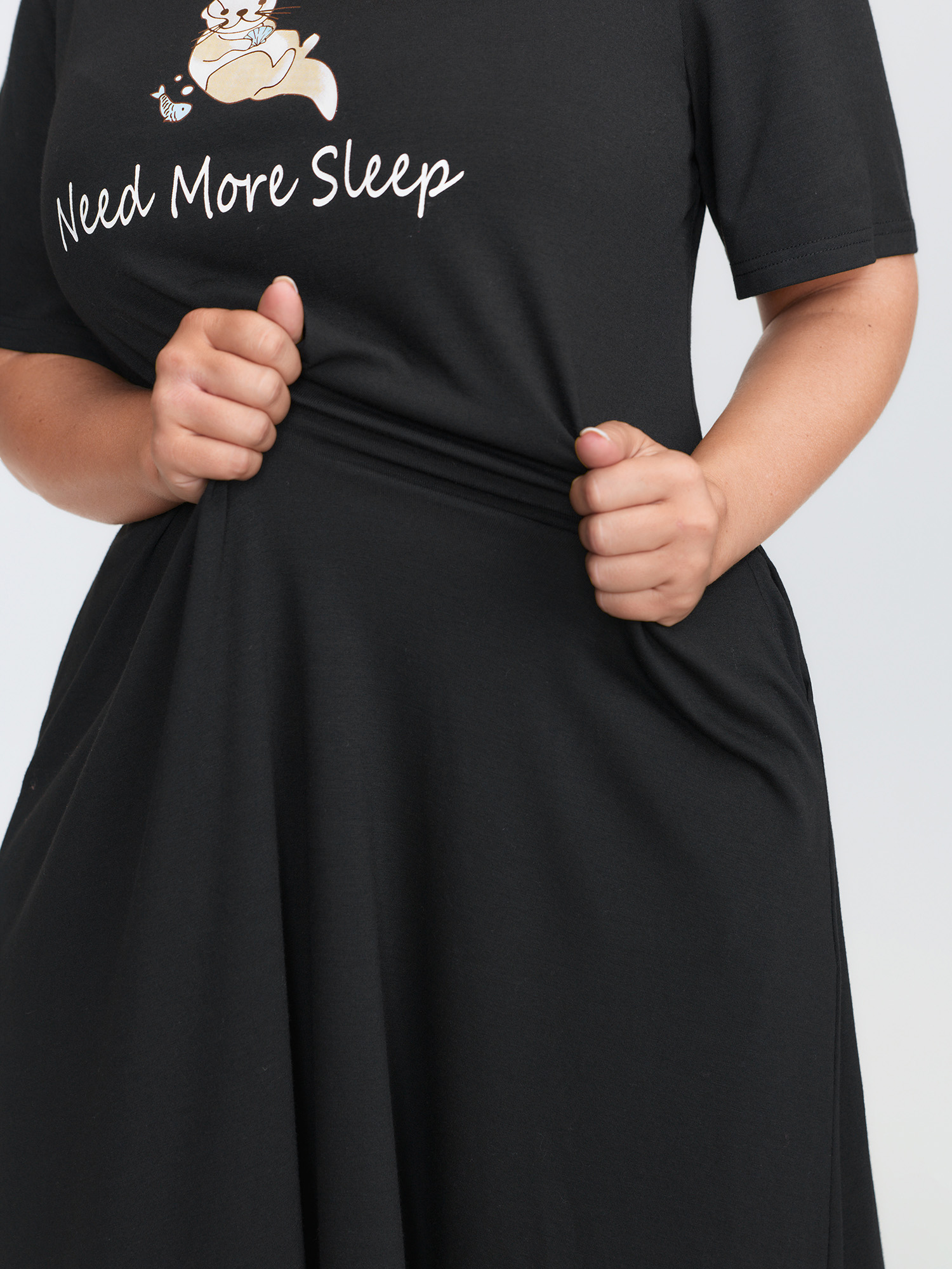 Side view of BloomChic Women's Plus Size Ultra-Comfort Stretchy Otter Print Nightgown Black Short sleeve Round Neck 10/M