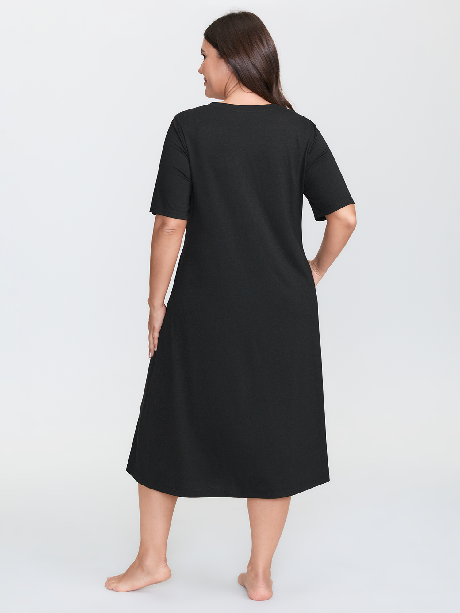 Side view of BloomChic Women's Plus Size Ultra-Comfort Stretchy Otter Print Nightgown Black Short sleeve Round Neck 10/M