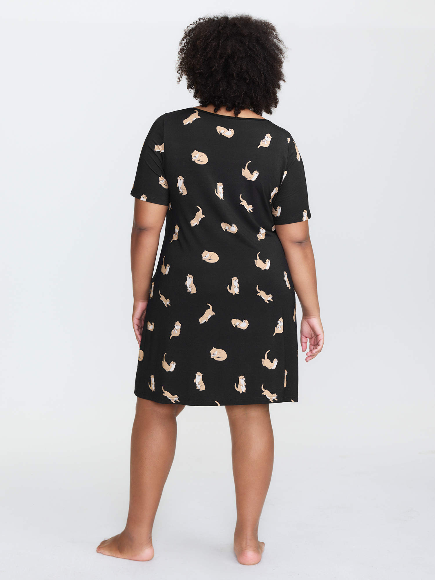 Side view of BloomChic Women's Plus Size Otter Print Stretchy Button Detail Nightgown Black Short sleeve Short 30/6X