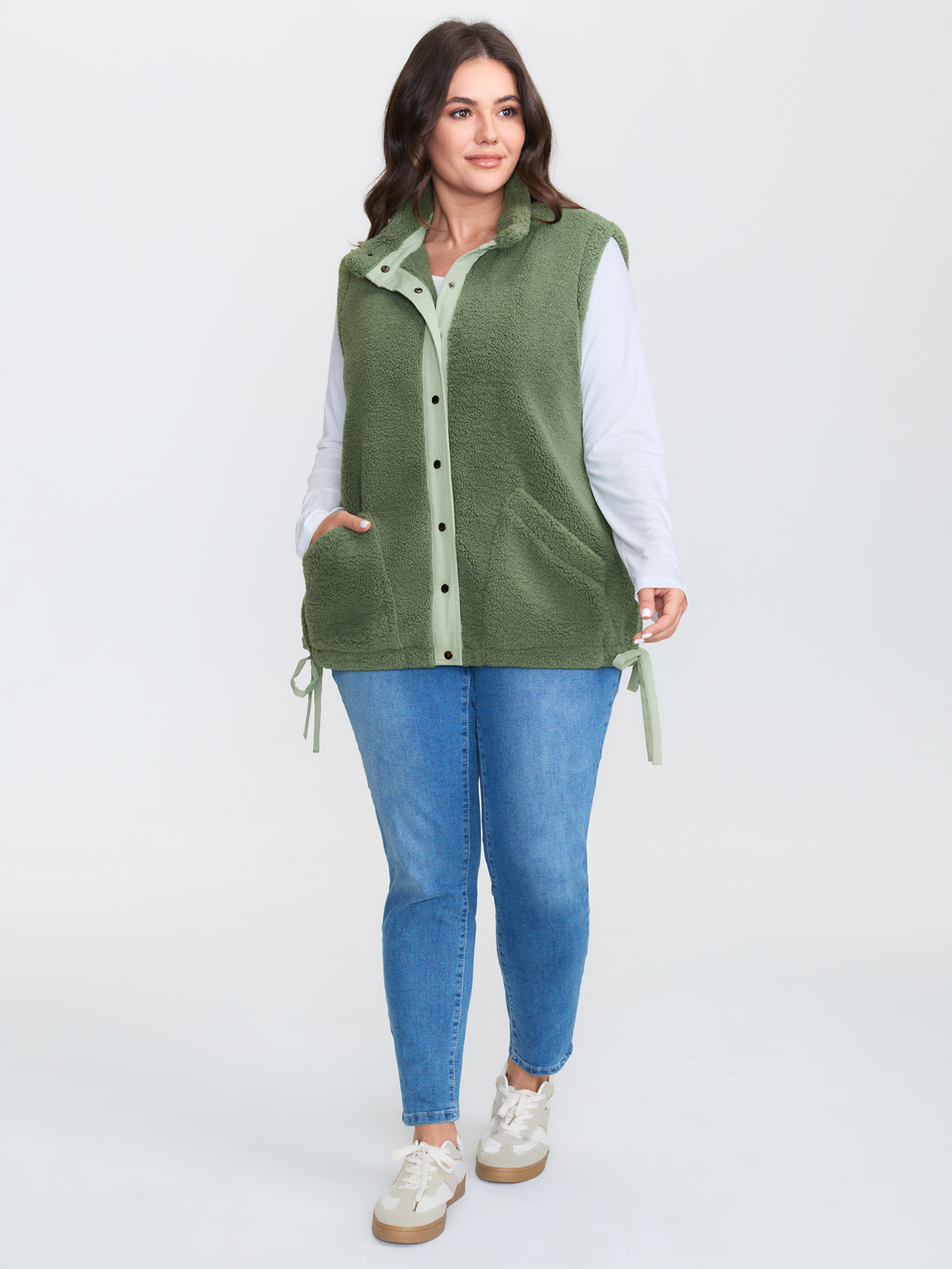 Side view of BloomChic Women's Plus Size Warm & Cozy Textured Pockets Vest Sage Bowknot 14-16/1X