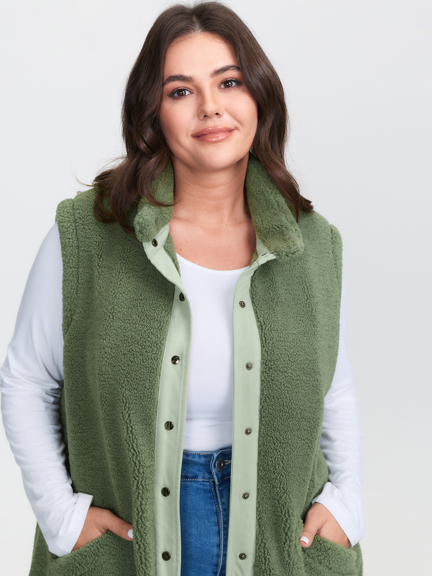 Side view of BloomChic Women's Plus Size Warm & Cozy Textured Pockets Vest Sage Bowknot 14-16/1X