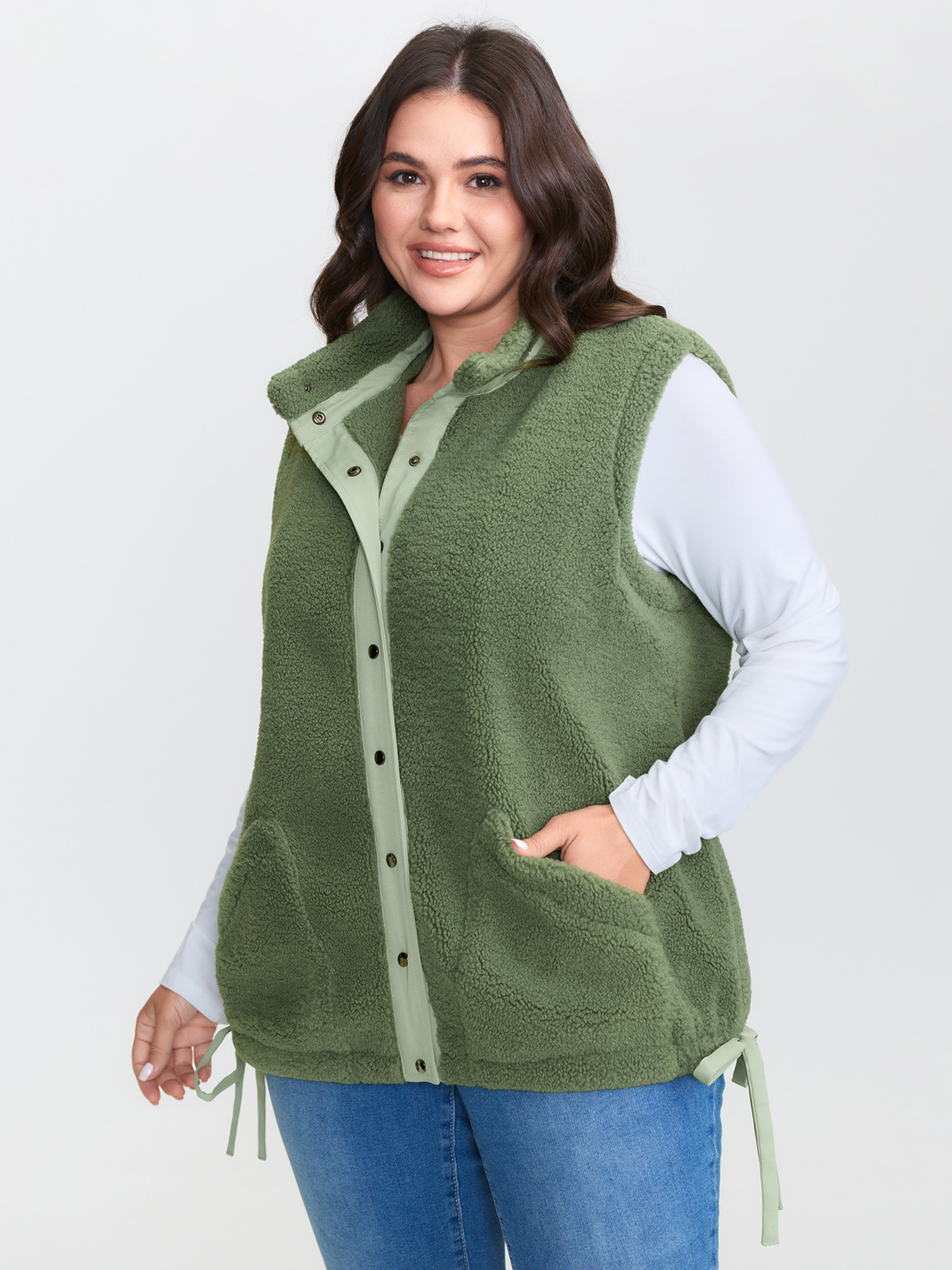 Side view of BloomChic Women's Plus Size Warm & Cozy Textured Pockets Vest Sage Bowknot 14-16/1X