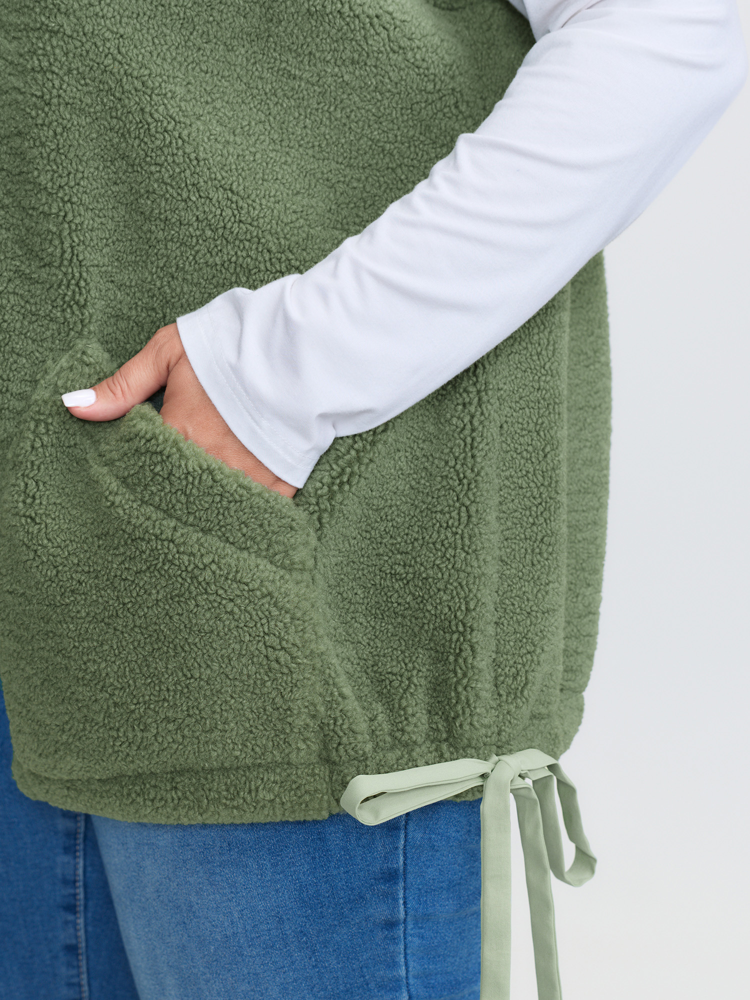 Side view of BloomChic Women's Plus Size Warm & Cozy Textured Pockets Vest Sage Bowknot 14-16/1X