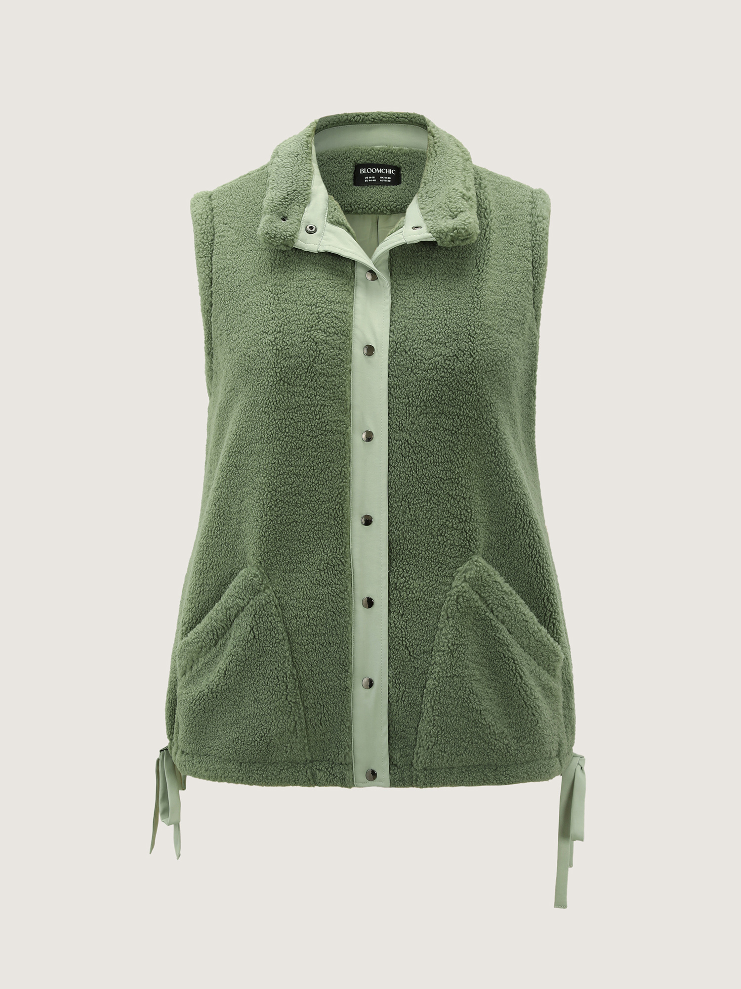 Side view of BloomChic Women's Plus Size Warm & Cozy Textured Pockets Vest Sage Bowknot 14-16/1X