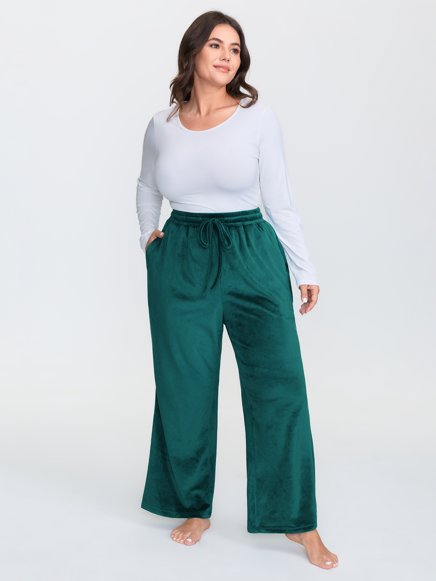 Side view of BloomChic Women's Plus Size Drawstring Waist Side Pockets Flared Lounge Bottoms Emerald Full 30/6X