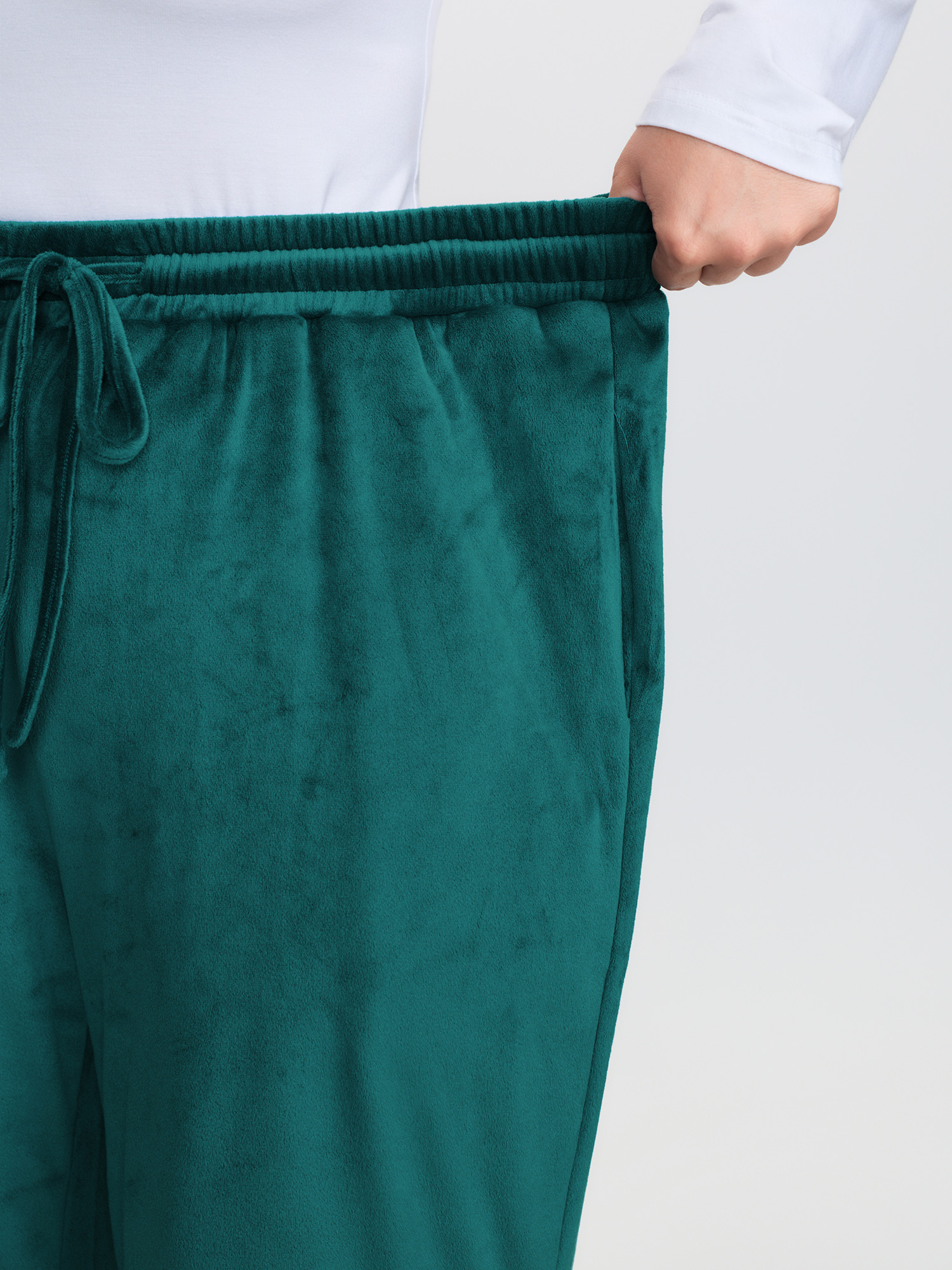 Side view of BloomChic Women's Plus Size Drawstring Waist Side Pockets Flared Lounge Bottoms Emerald Full 30/6X