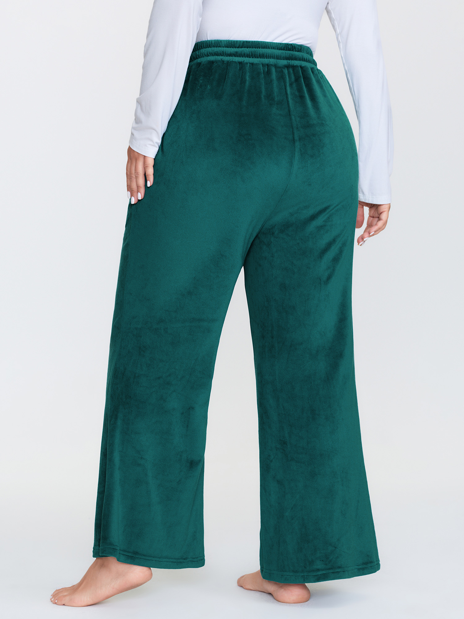 Side view of BloomChic Women's Plus Size Drawstring Waist Side Pockets Flared Lounge Bottoms Emerald Full 30/6X