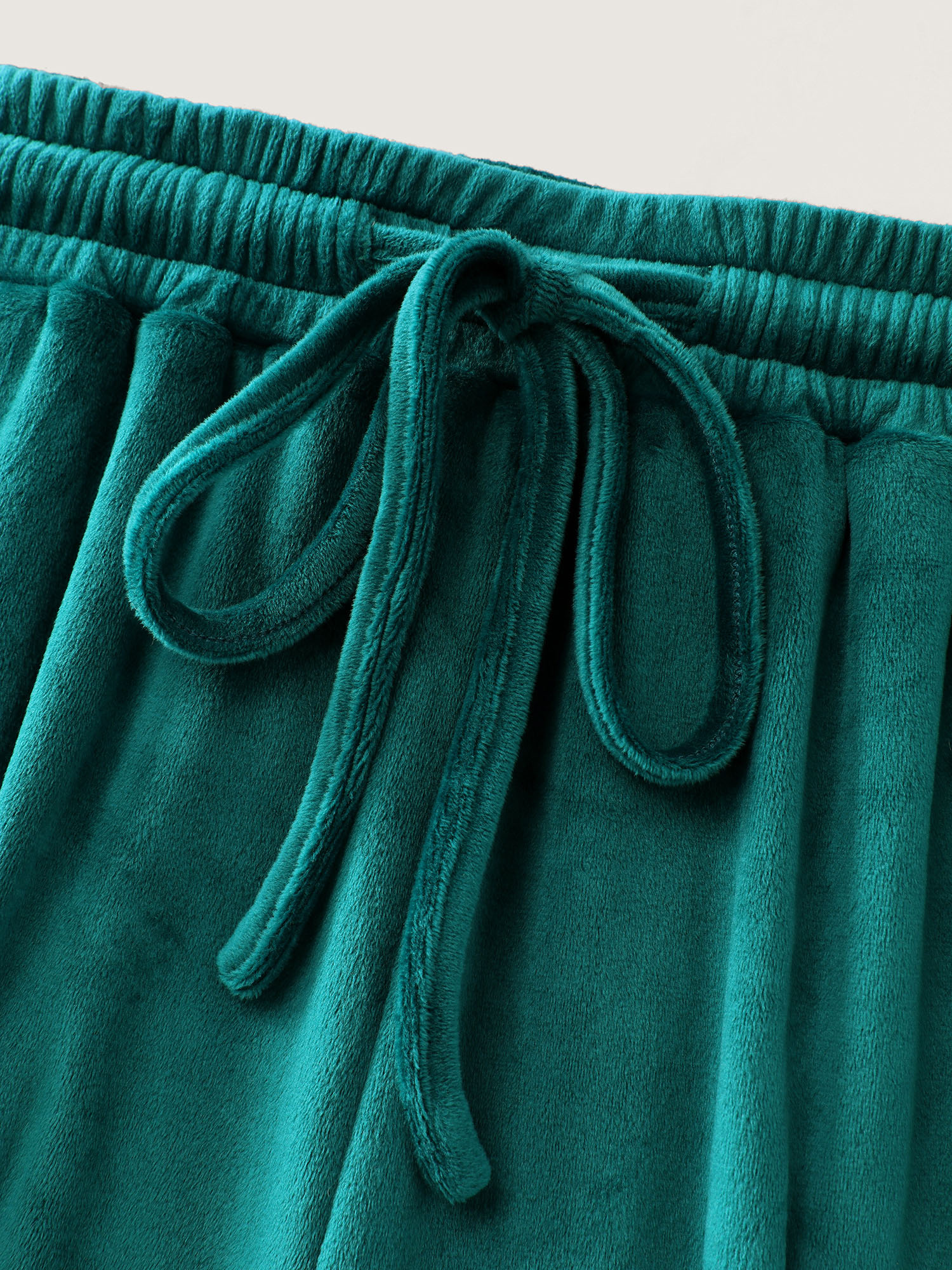 Side view of BloomChic Women's Plus Size Drawstring Waist Side Pockets Flared Lounge Bottoms Emerald Full 30/6X
