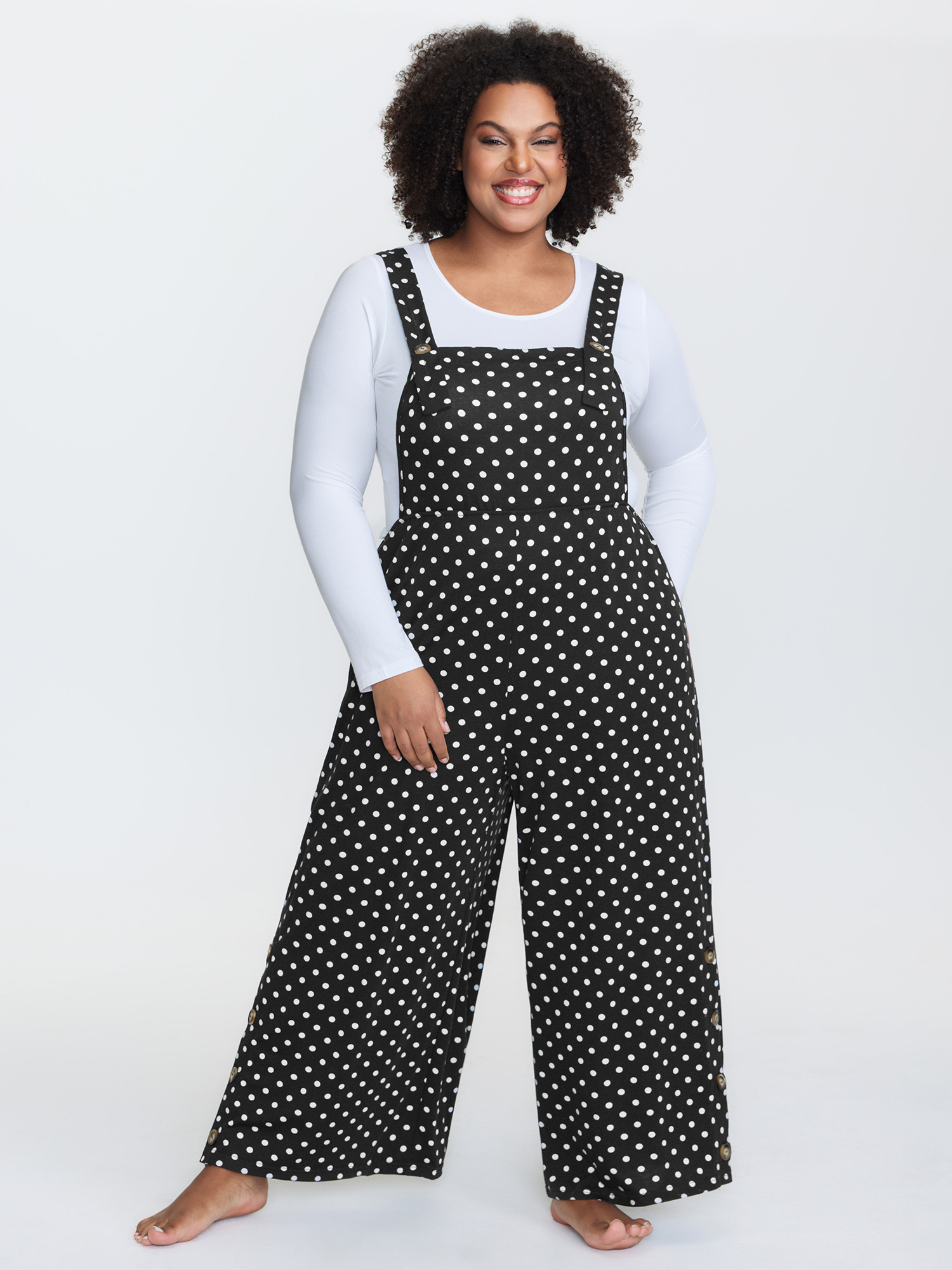 Side view of BloomChic Women's Plus Size Stretchy Polka Dots Lounge Jumpsuit Black Maxi 10/M