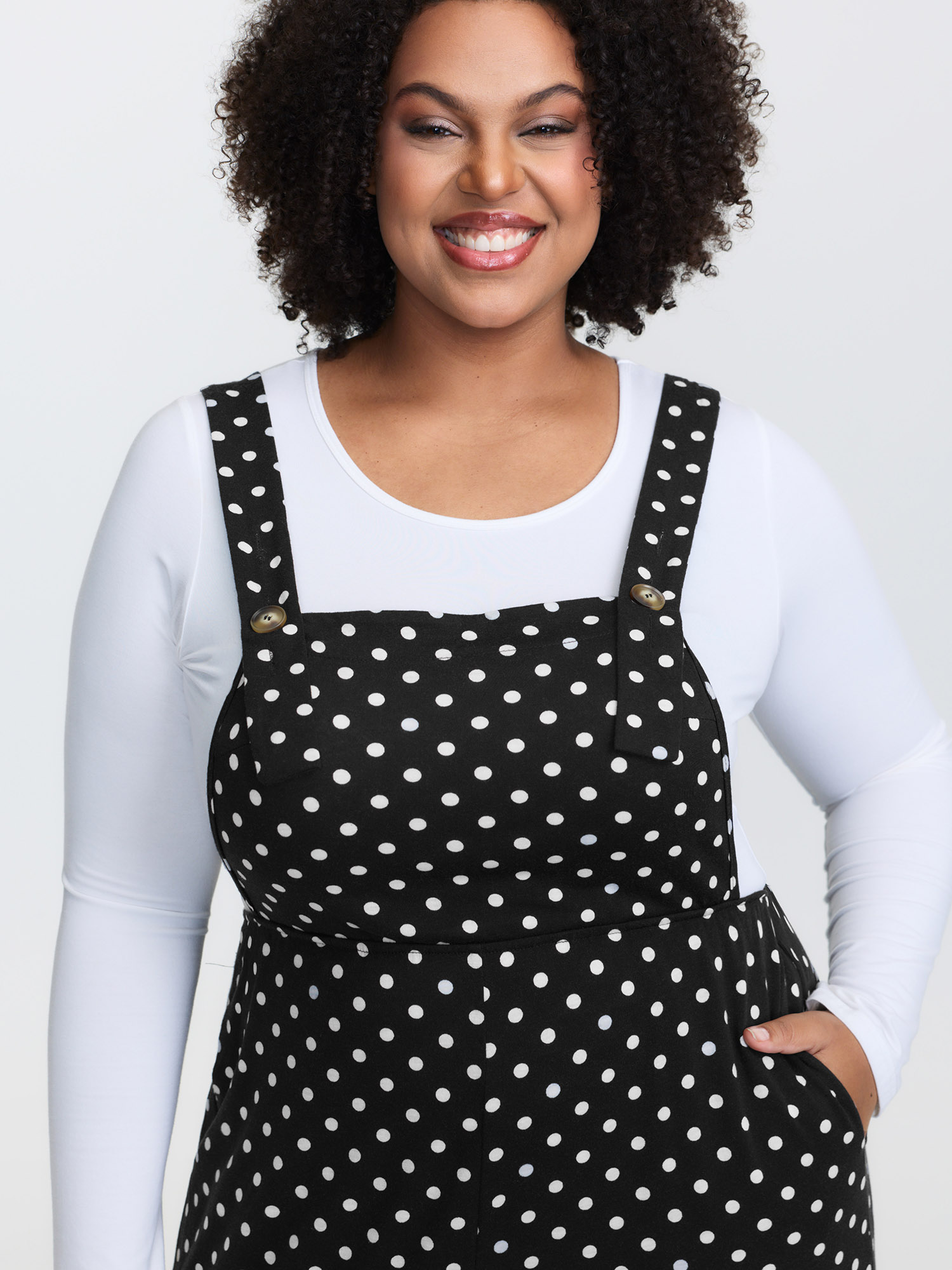 Side view of BloomChic Women's Plus Size Stretchy Polka Dots Lounge Jumpsuit Black Maxi 10/M