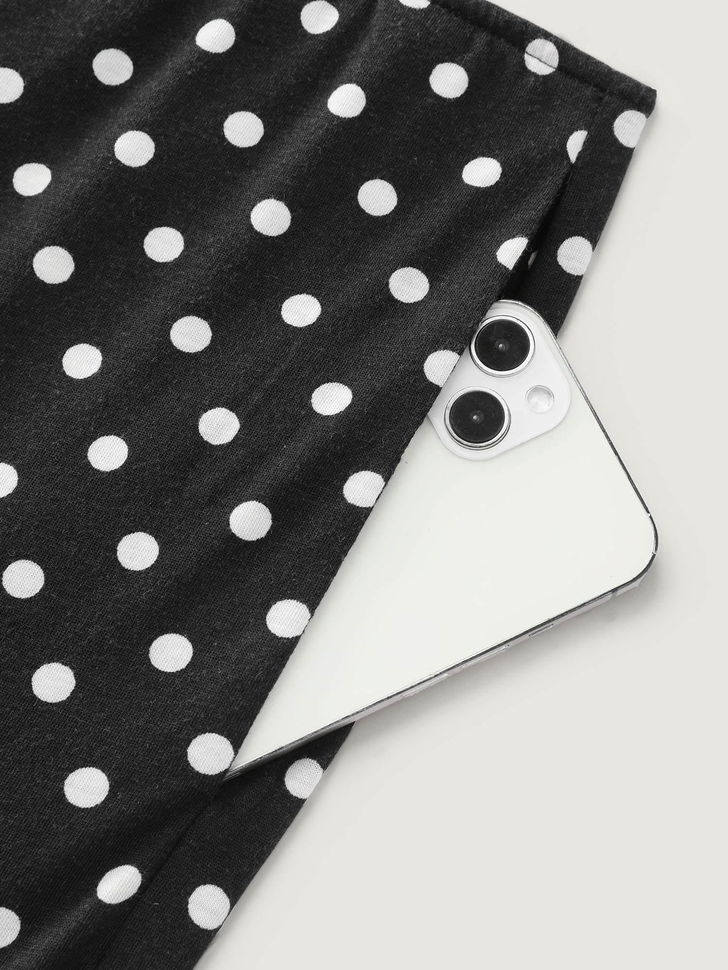 Side view of BloomChic Women's Plus Size Stretchy Polka Dots Lounge Jumpsuit Black Maxi 10/M