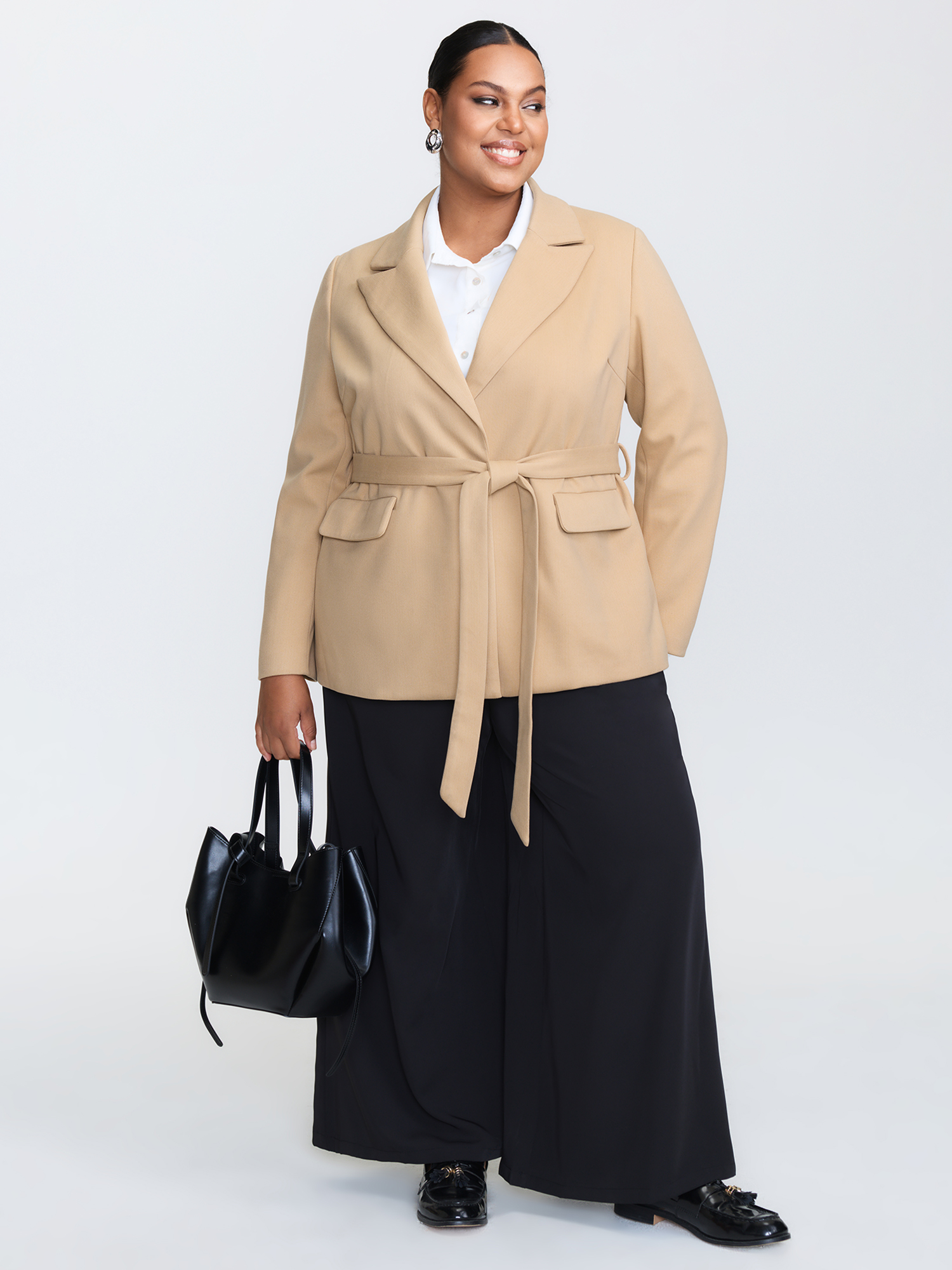 Side view of BloomChic Women's Plus Size Textured Belted Plain Blazer Tan not graphics Wide Waistband Sleeve Long Sleeve Notched Lapel 26/4X