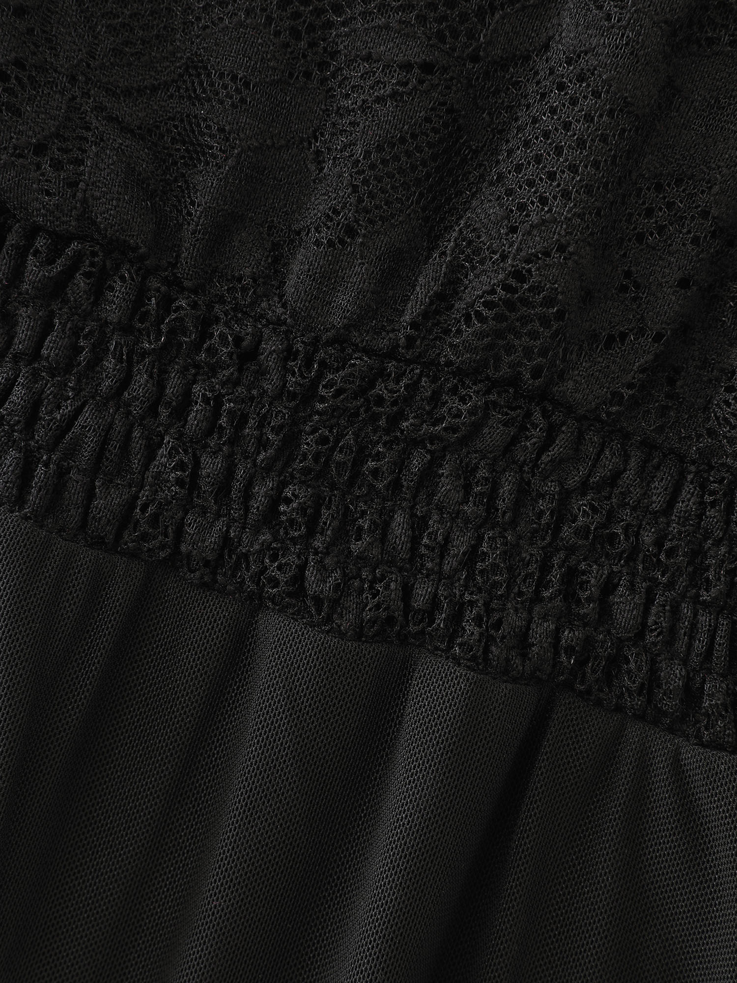 Side view of BloomChic Women's Plus Size Sheer Lace Ruffled Cut-Out Nightgown Black Sleeveless Tunic 10/M