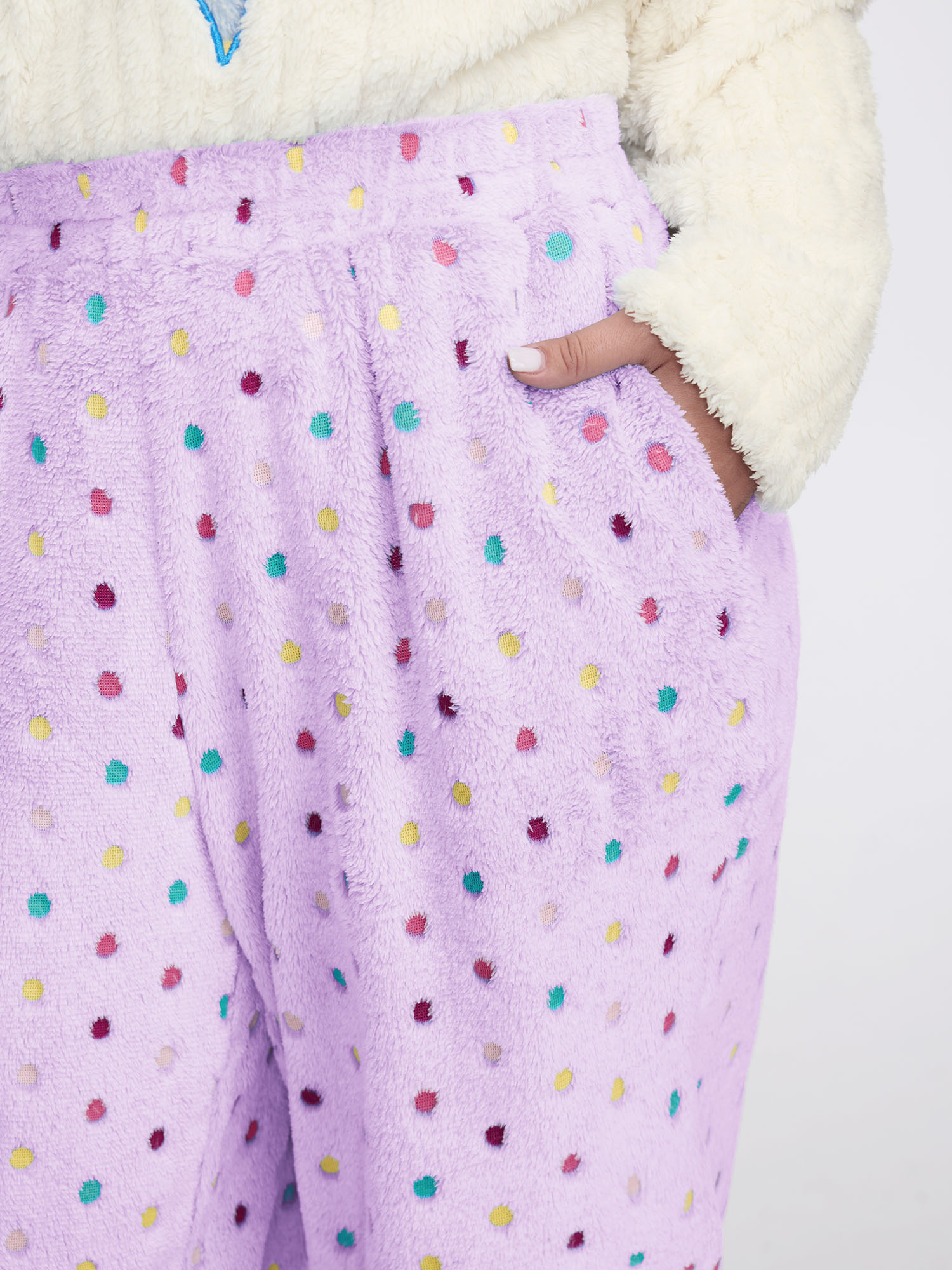 Side view of BloomChic Women's Plus Size Fluffy Textured Polka Dots Lounge Bottoms Lilac 30/6X