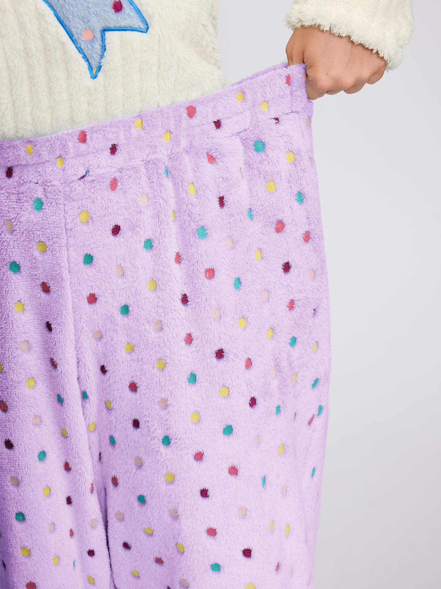 Side view of BloomChic Women's Plus Size Fluffy Textured Polka Dots Lounge Bottoms Lilac 30/6X