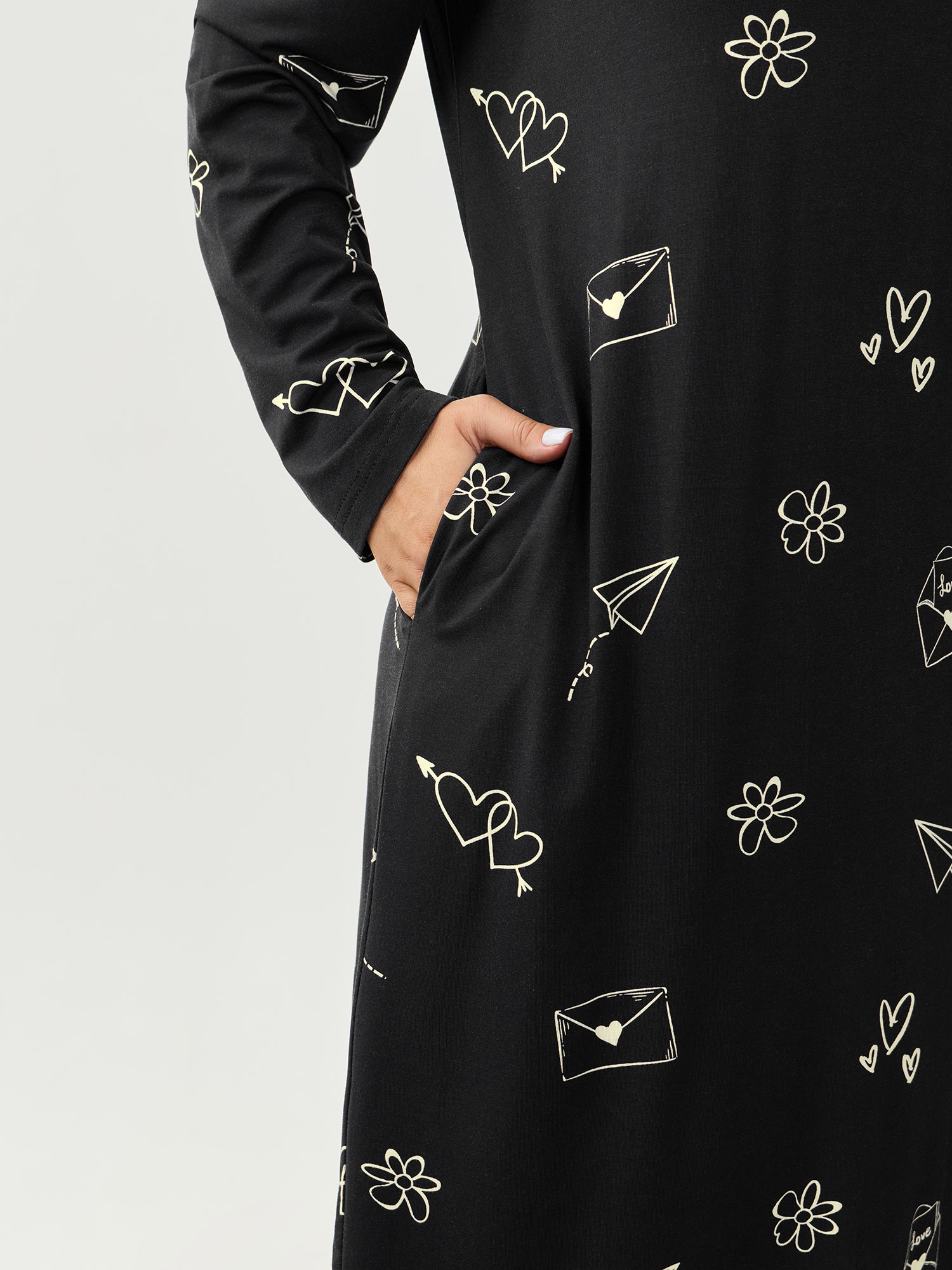 Side view of BloomChic Women's Plus Size Supersoft Love Letter Print Lounge Dress Black Tunic 28/5X
