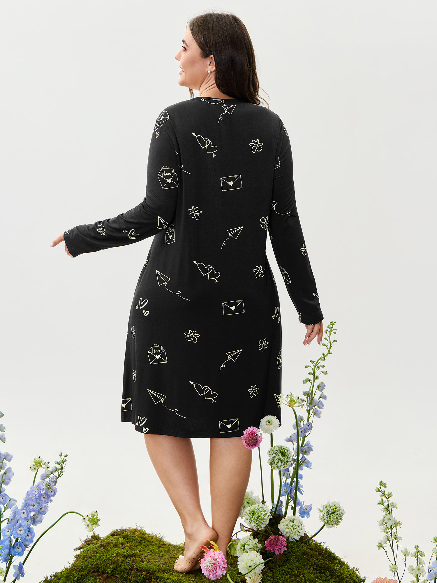 Side view of BloomChic Women's Plus Size Supersoft Love Letter Print Lounge Dress Black Tunic 28/5X